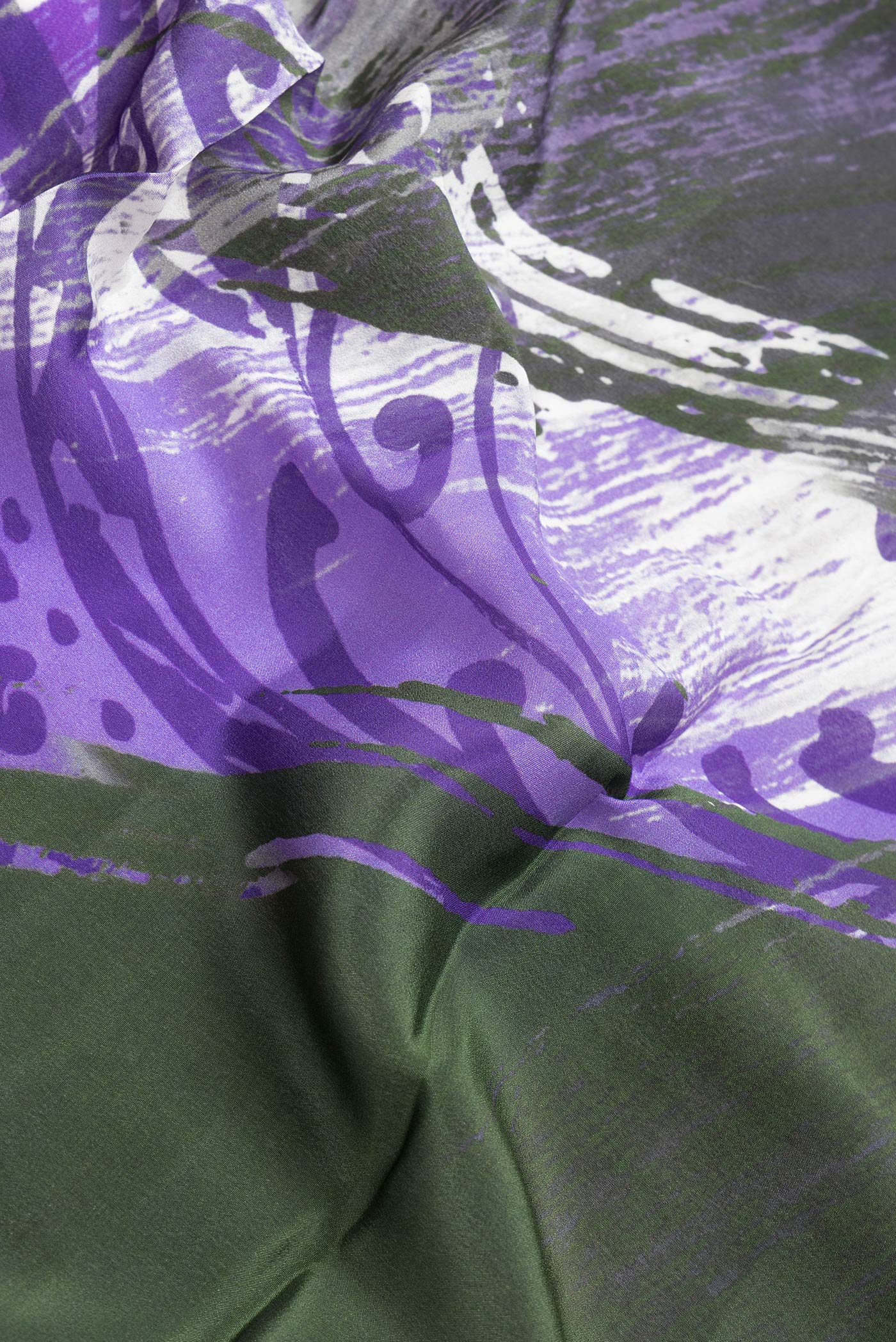 Close up of Mehandi Green Dual Tone Mysore Crepe Saree with Printed design on the body and Plain Border.  displaying folds