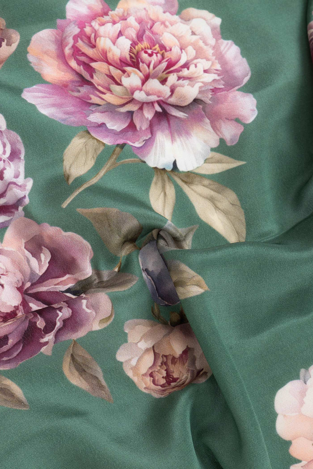 Close up of Green Dual Tone Mysore Crepe Saree with Printed design on the body and Without Border.  displaying folds