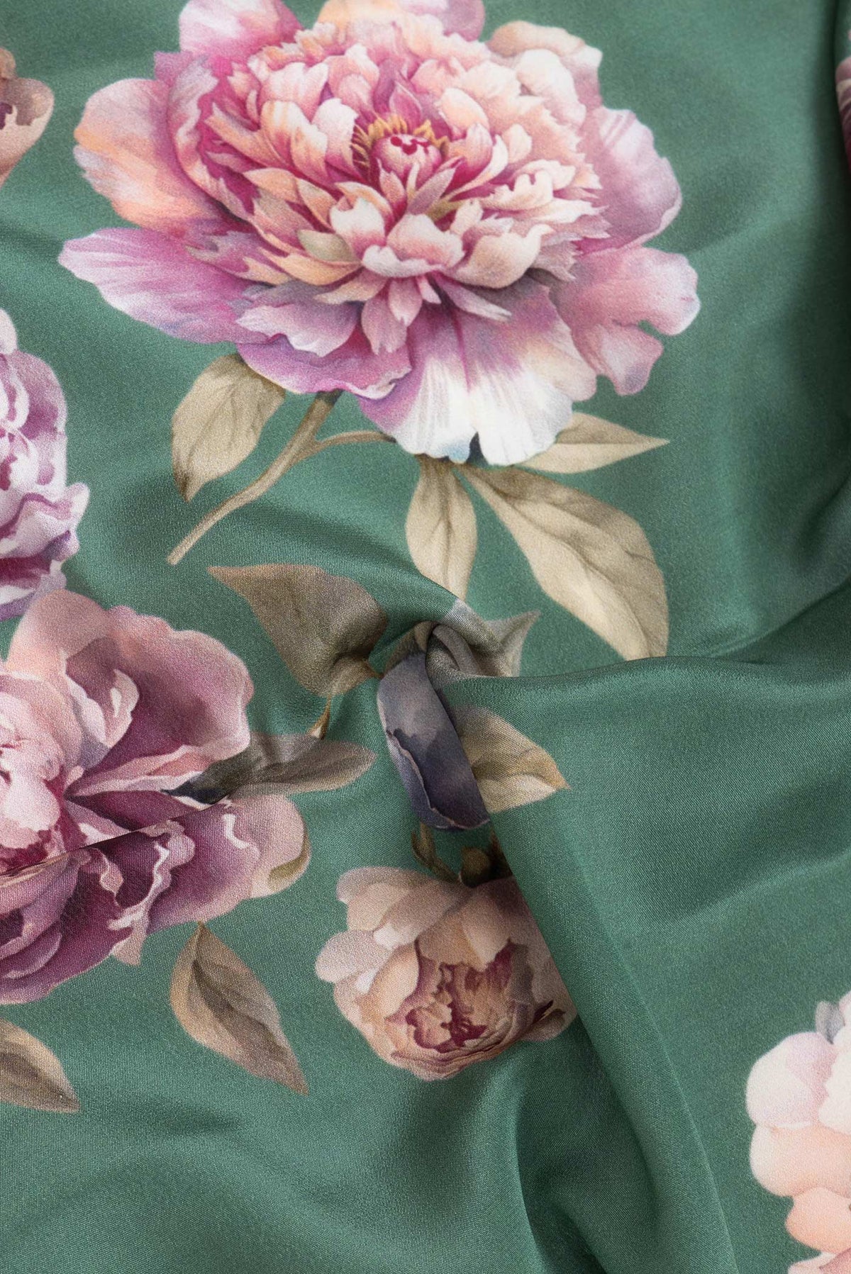 Close up of Green Dual Tone Mysore Crepe Saree with Printed design on the body and Without Border.  displaying folds
