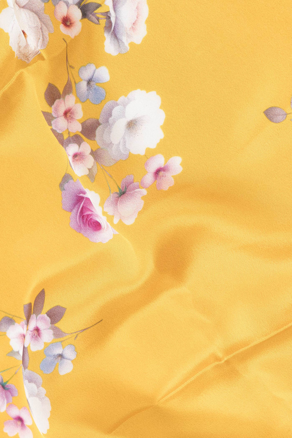 Close up of Yellow Dual Tone Mysore Crepe Saree with Printed design on the body and Without Border.  displaying folds