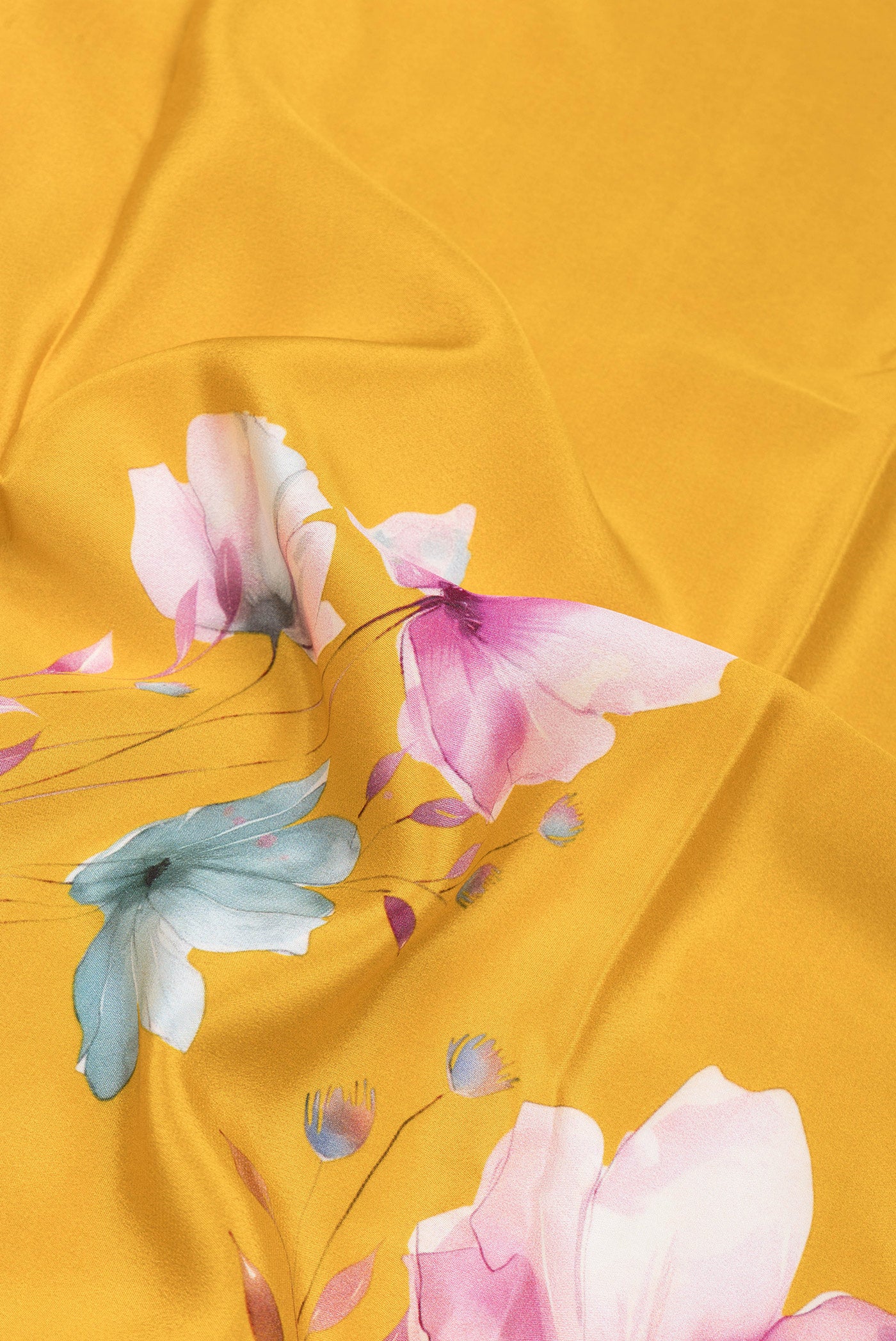 Close up of Yellow Crepe Saree with Floral Print on the body and Without Border.  displaying folds