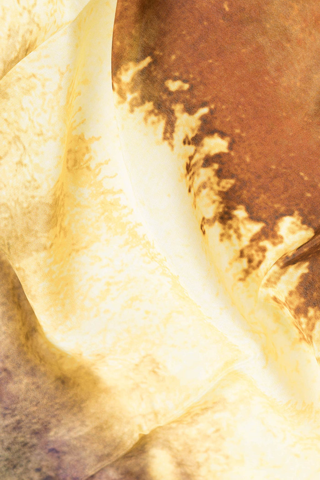 Close up of Violet Dual Tone Mysore Crepe Saree with Printed design on the body and Plain Border.  displaying folds