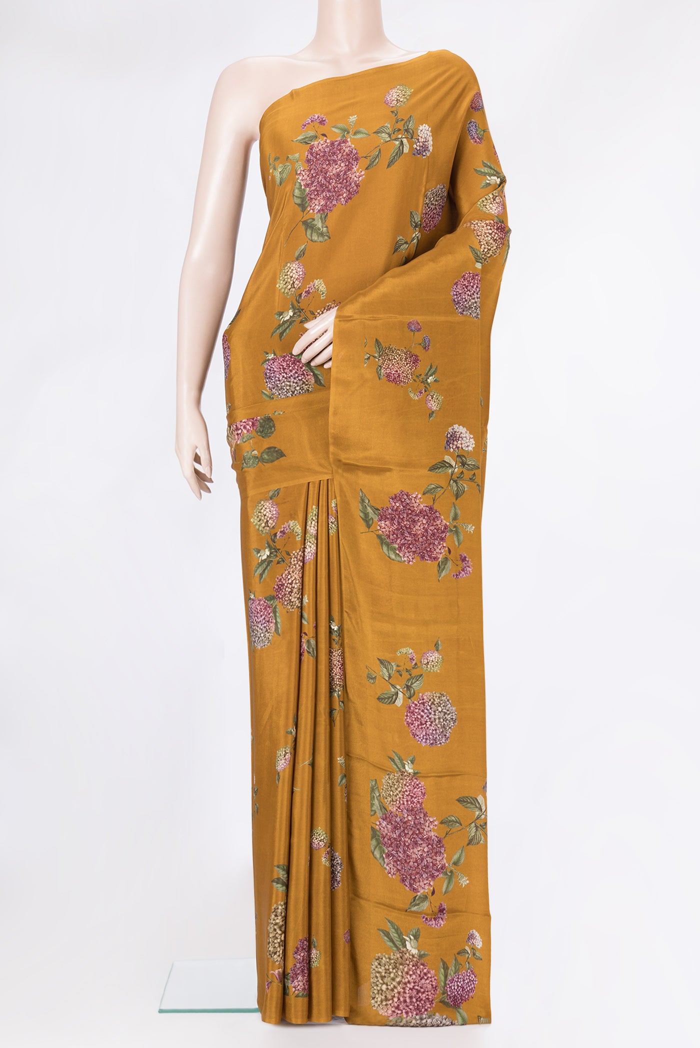 Mustard Dual Tone Crepe Saree with Printed design on the body and Without Border.  displayed on a mannequin