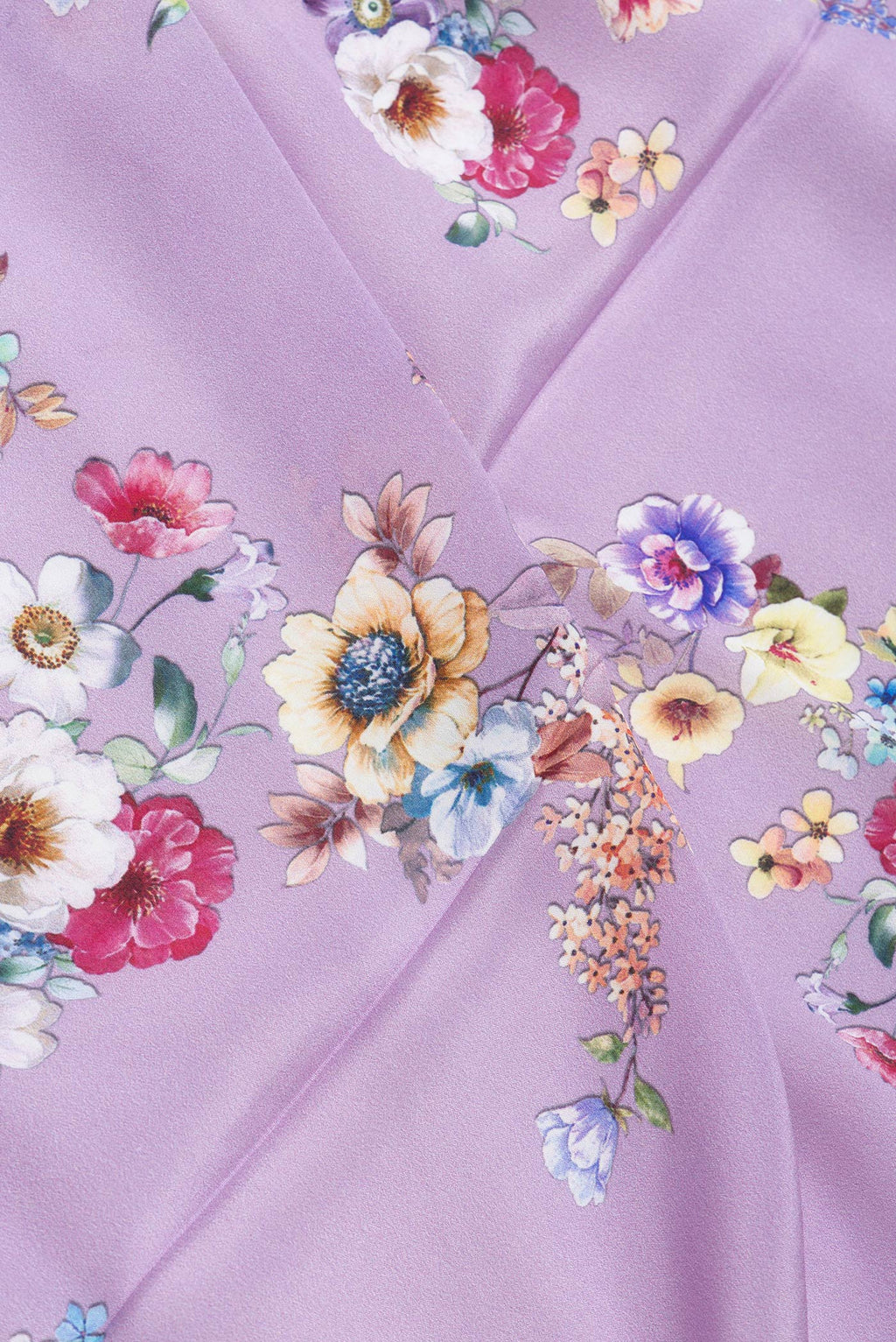 Close up of Lavender Dual Tone Mysore Crepe Saree with Printed design on the body and Without Border.  displaying folds