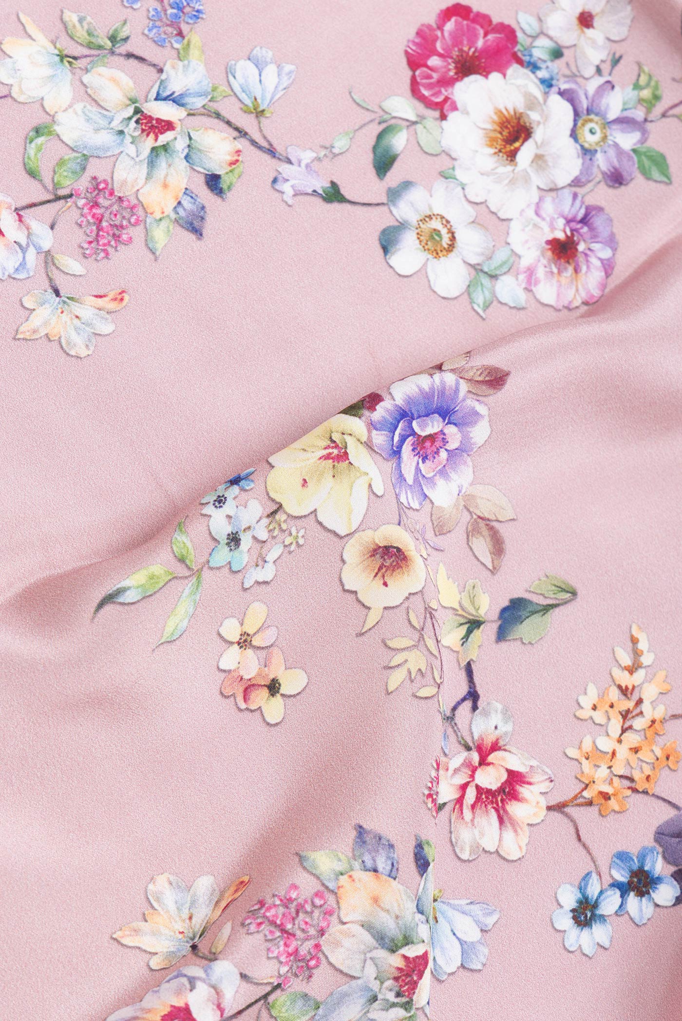 Close up of Pink Dual Tone Mysore Crepe Saree with Printed design on the body and Without Border.  displaying folds
