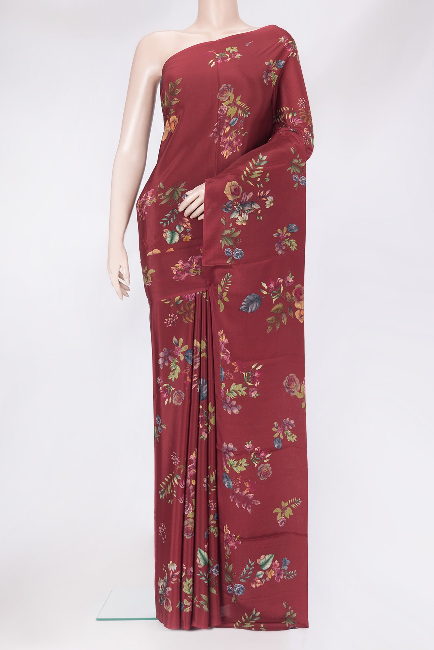 Maroon Crepe Saree with Floral Print on the body and Without Border.  displayed on a mannequin