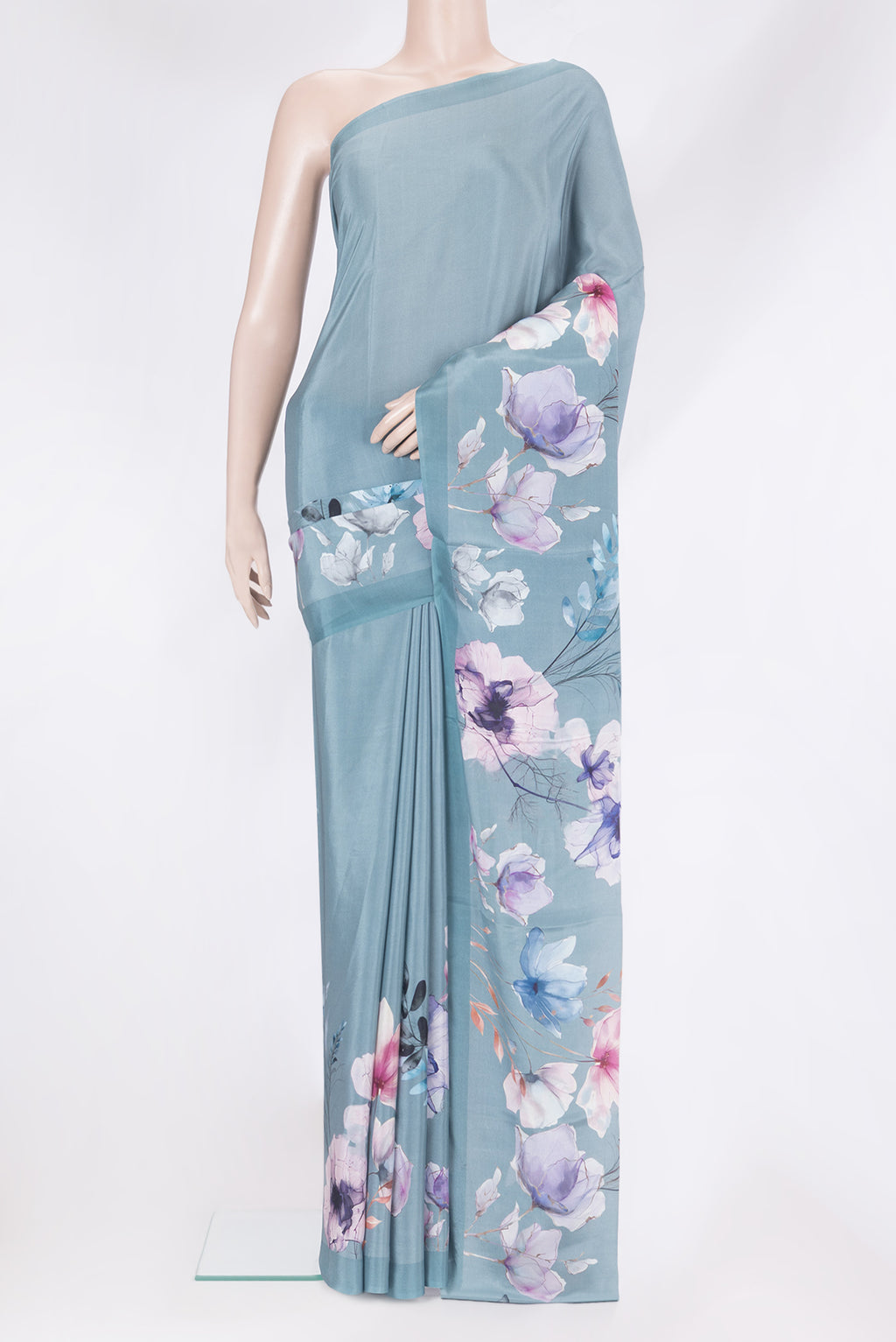 Grey Crepe Saree with Printed design on the body and Plain Border.  displayed on a mannequin