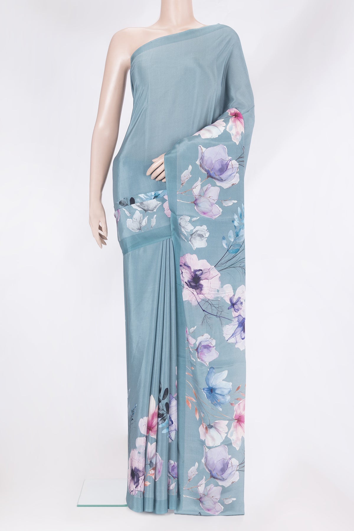 Grey Crepe Saree with Printed design on the body and Plain Border.  displayed on a mannequin