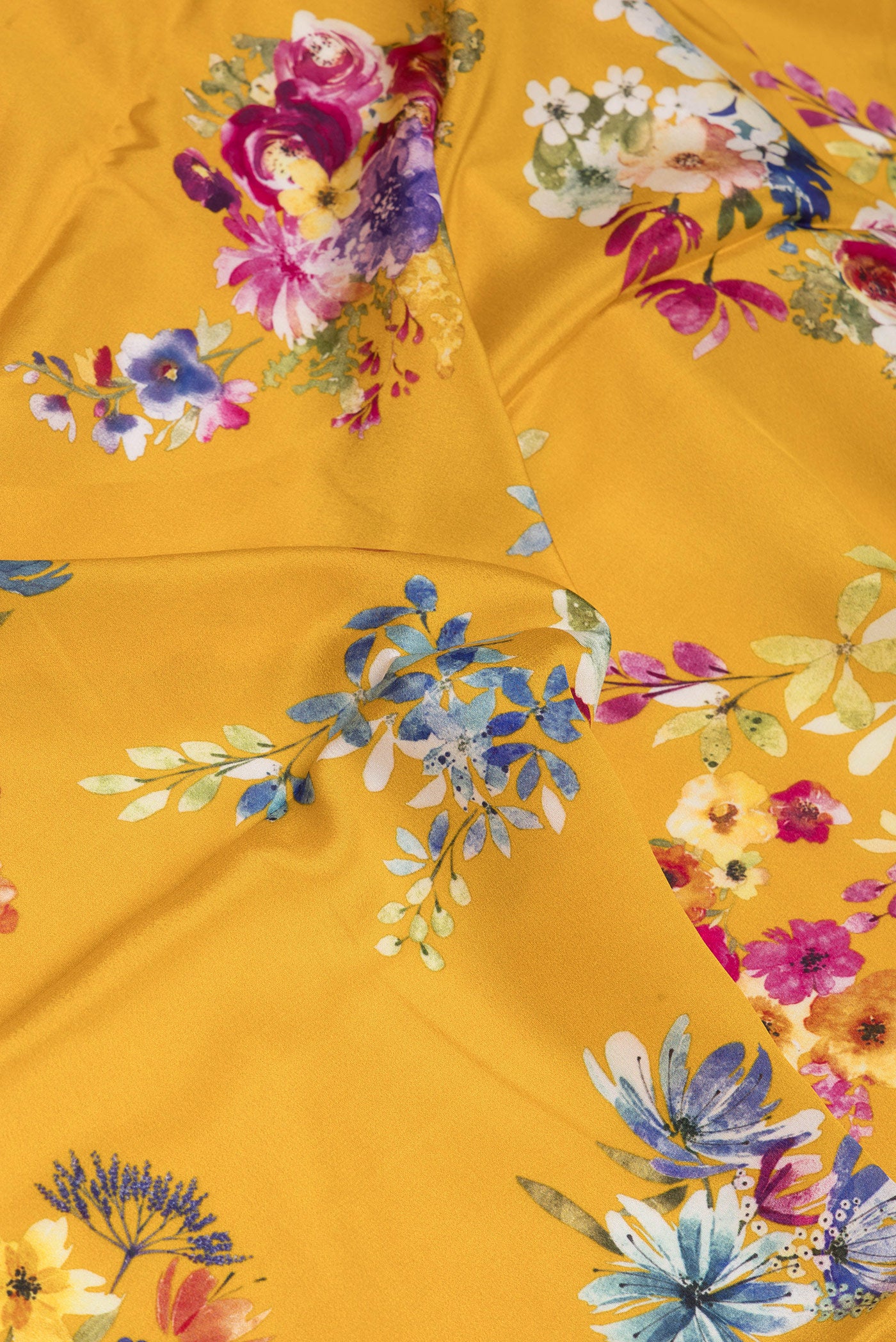 Close up of Mustard Dual Tone Crepe Saree with Floral Print on the body and Plain Border.  displaying folds