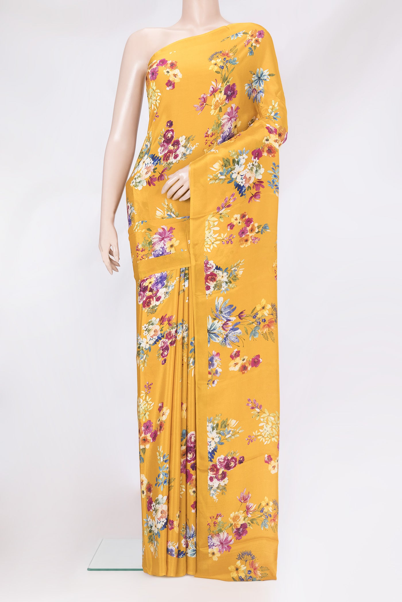Mustard Dual Tone Crepe Saree with Floral Print on the body and Plain Border.  displayed on a mannequin