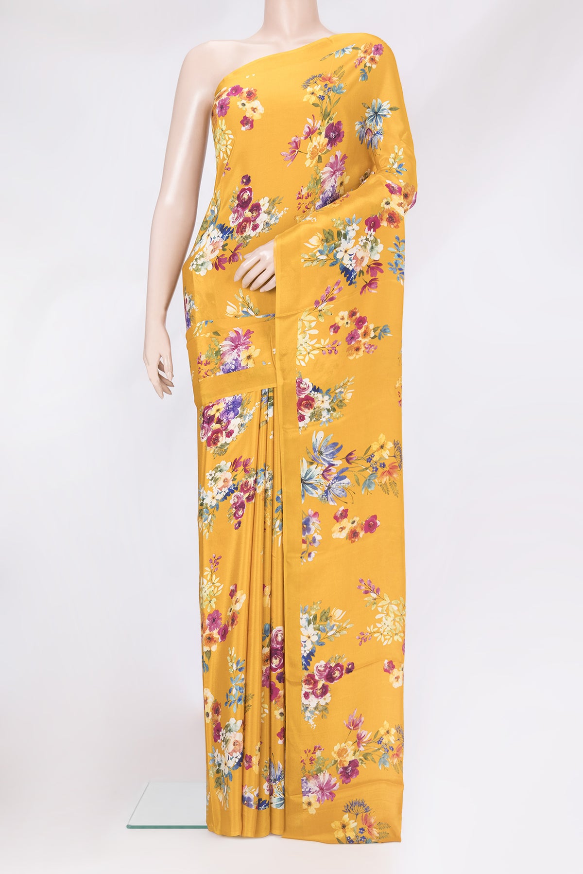 Mustard Dual Tone Crepe Saree with Floral Print on the body and Plain Border.  displayed on a mannequin
