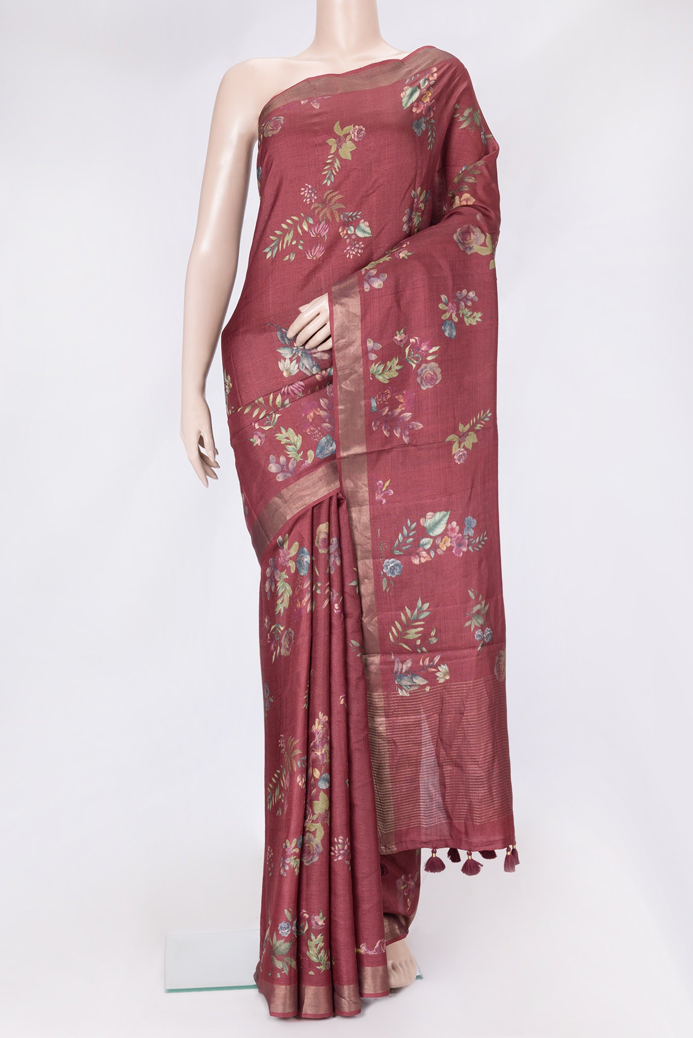 Maroon Dual Tone Tussar Silk Saree with Printed design on the body and Zari Border.  displayed on a mannequin