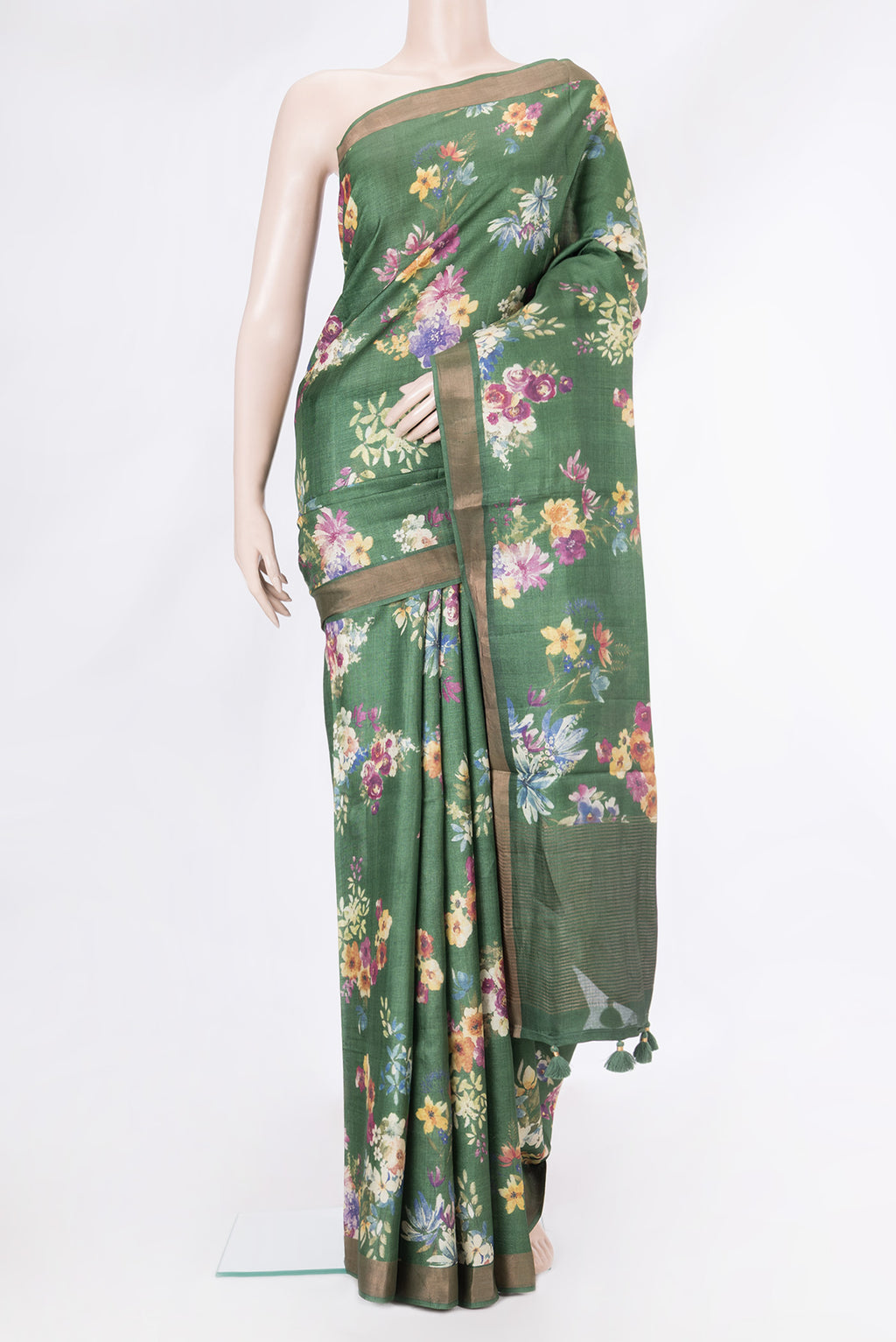 Olive Green Tussar Silk Saree with Floral Print on the body and Zari Border.  displayed on a mannequin