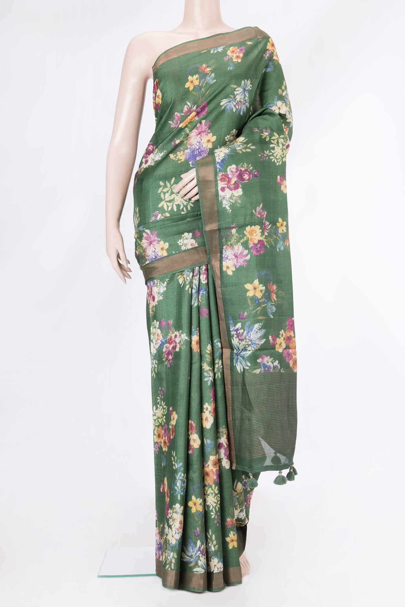 Olive Green Tussar Silk Saree with Floral Print on the body and Zari Border.  displayed on a mannequin