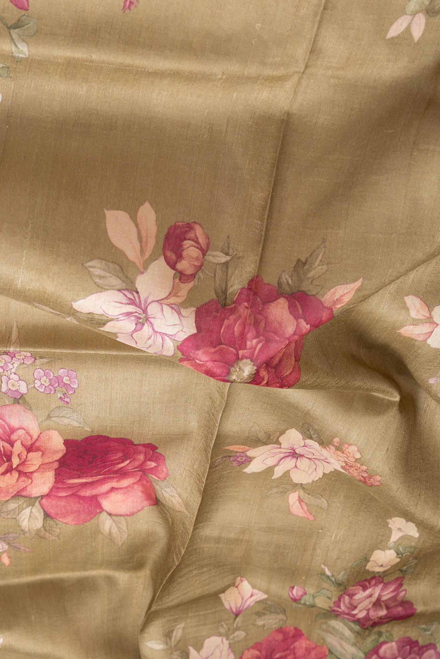 Close up of Mehandi Green Dual Tone Tussar Silk Saree with Printed design on the body and Zari Border.  displaying folds