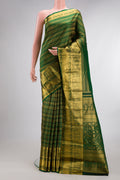 Pure Silk Bottle Green Kanchipuram Saree with Zari Brocade on the body and Fancy Border.  displayed on a mannequin