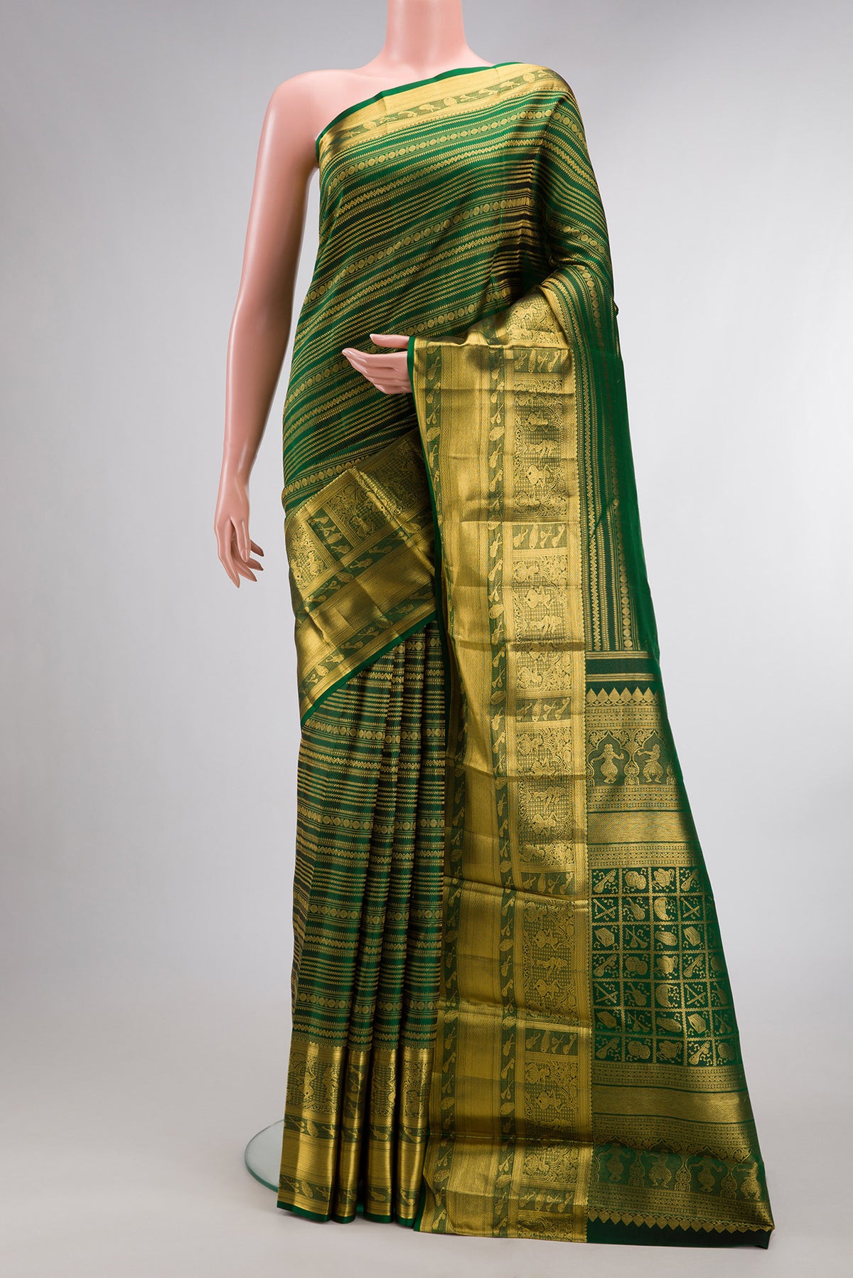Pure Silk Bottle Green Kanchipuram Saree with Zari Brocade on the body and Fancy Border.  displayed on a mannequin