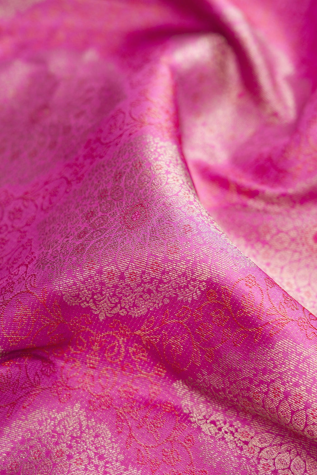 Close up of Pink Dual Tone Kanjivaram Silk Saree with Zari Brocade on the body and Zari Border.  displaying folds