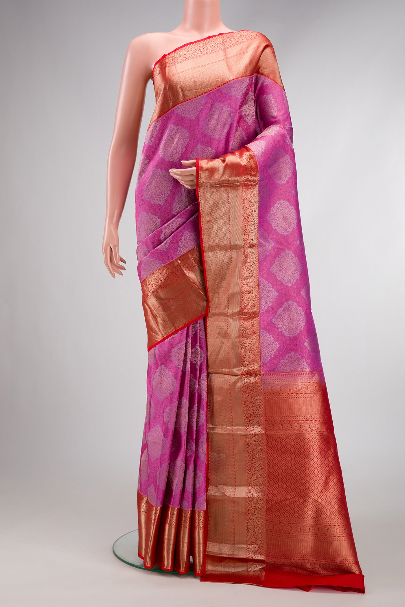 Pink Dual Tone Kanjivaram Silk Saree with Zari Brocade on the body and Zari Border.  displayed on a mannequin
