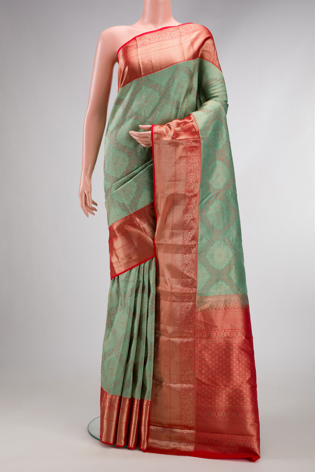 Light Green Dual Tone Kanjivaram Silk Saree with Zari Brocade on the body and Zari Border.  displayed on a mannequin