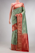 Light Green Dual Tone Kanjivaram Silk Saree with Zari Brocade on the body and Zari Border.  displayed on a mannequin