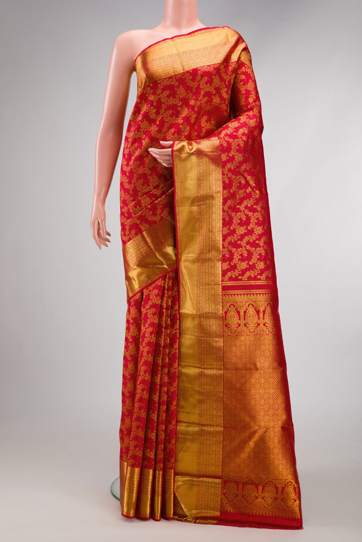 Red Dual Tone Kanjivaram Silk Saree with Zari Brocade on the body and Zari Border.  displayed on a mannequin
