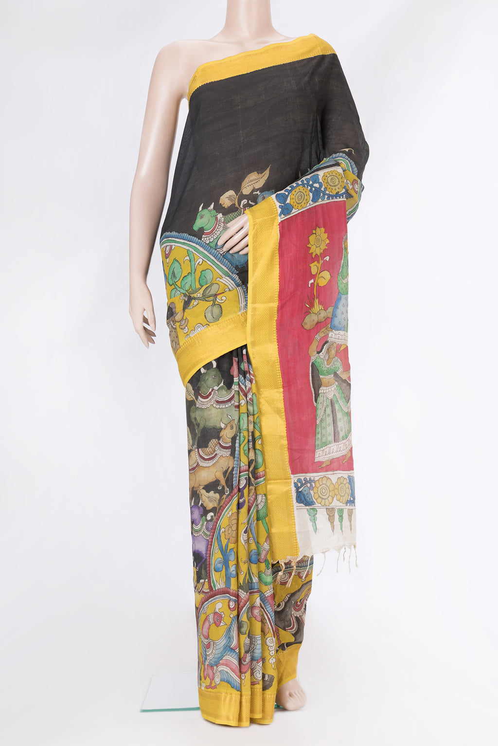 Yellow Tussar Silk Saree with kalamkari Print on the body and Zari Border.  displayed on a mannequin