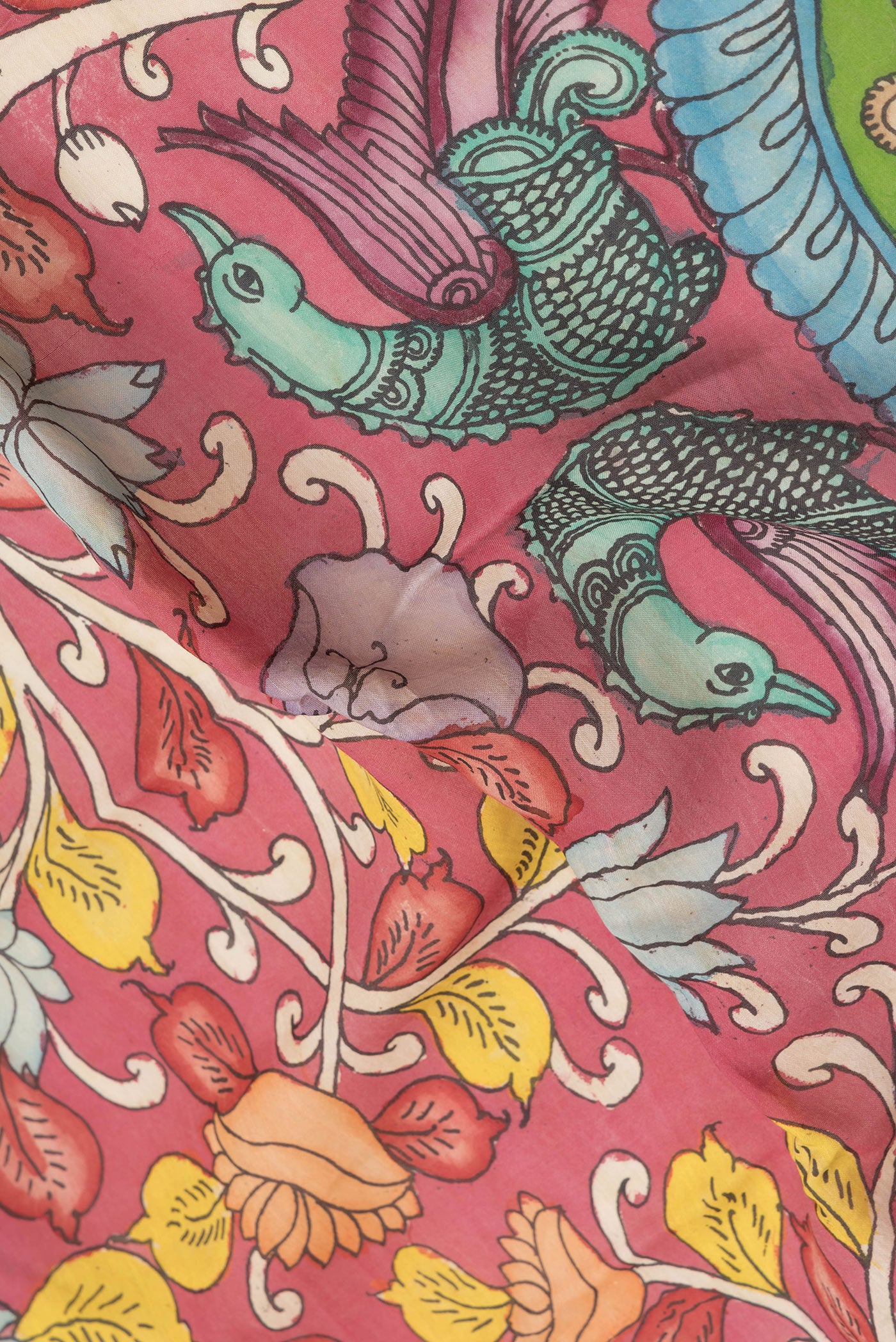 Close up of Pink Dual Tone Tussar Silk Saree with kalamkari Print on the body and Zari Border.  displaying folds