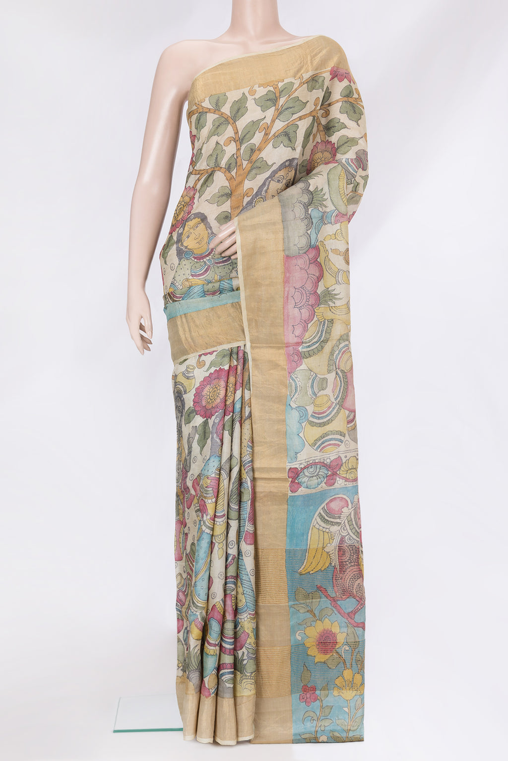 Beige Tussar Silk Saree with kalamkari Print on the body and Zari Border.  displayed on a mannequin