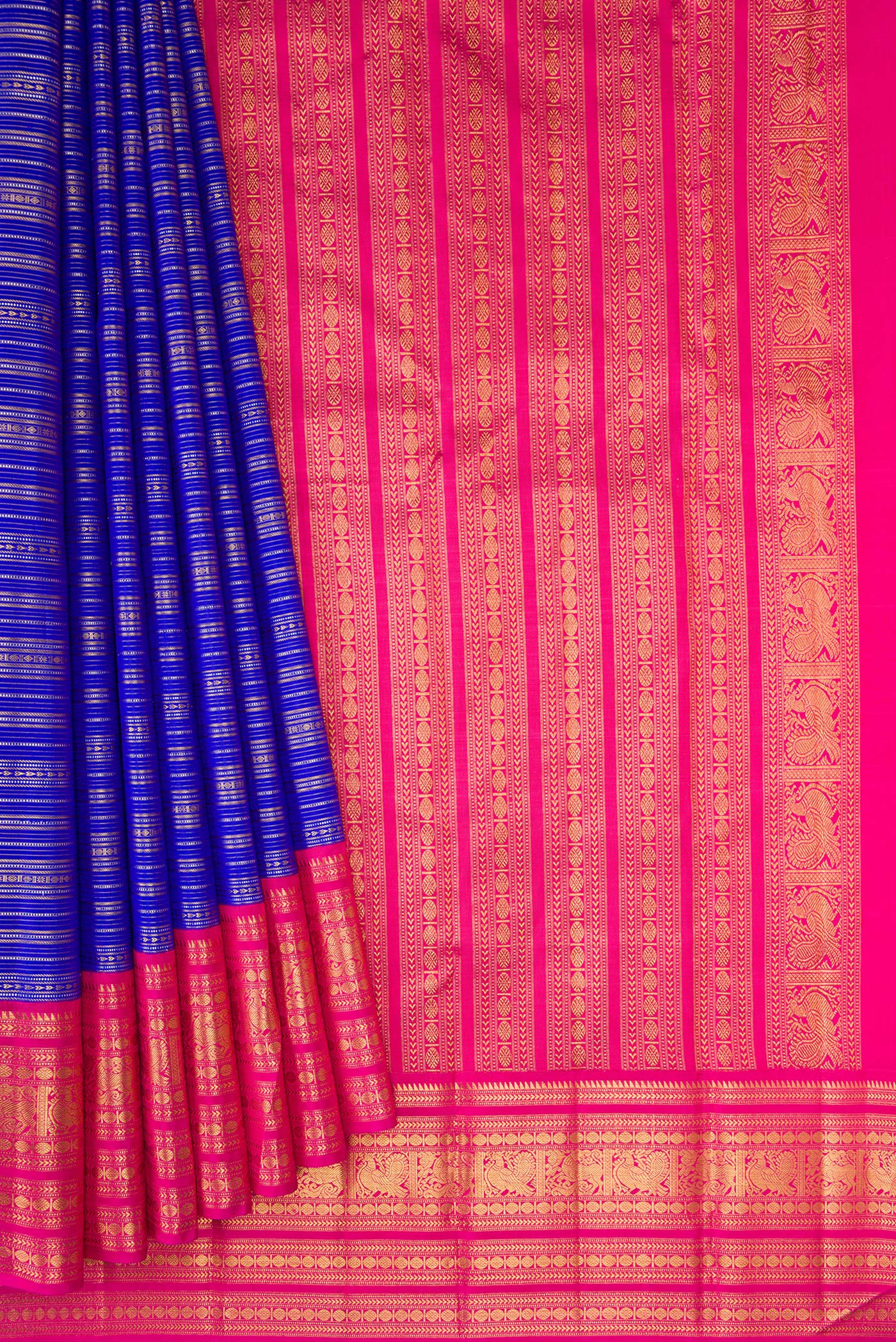 Pleats and pallu of Pure Silk Pure Zari Royal Blue Dual Tone Kanchipuram Saree with Stripes on the body and Zari Border. 