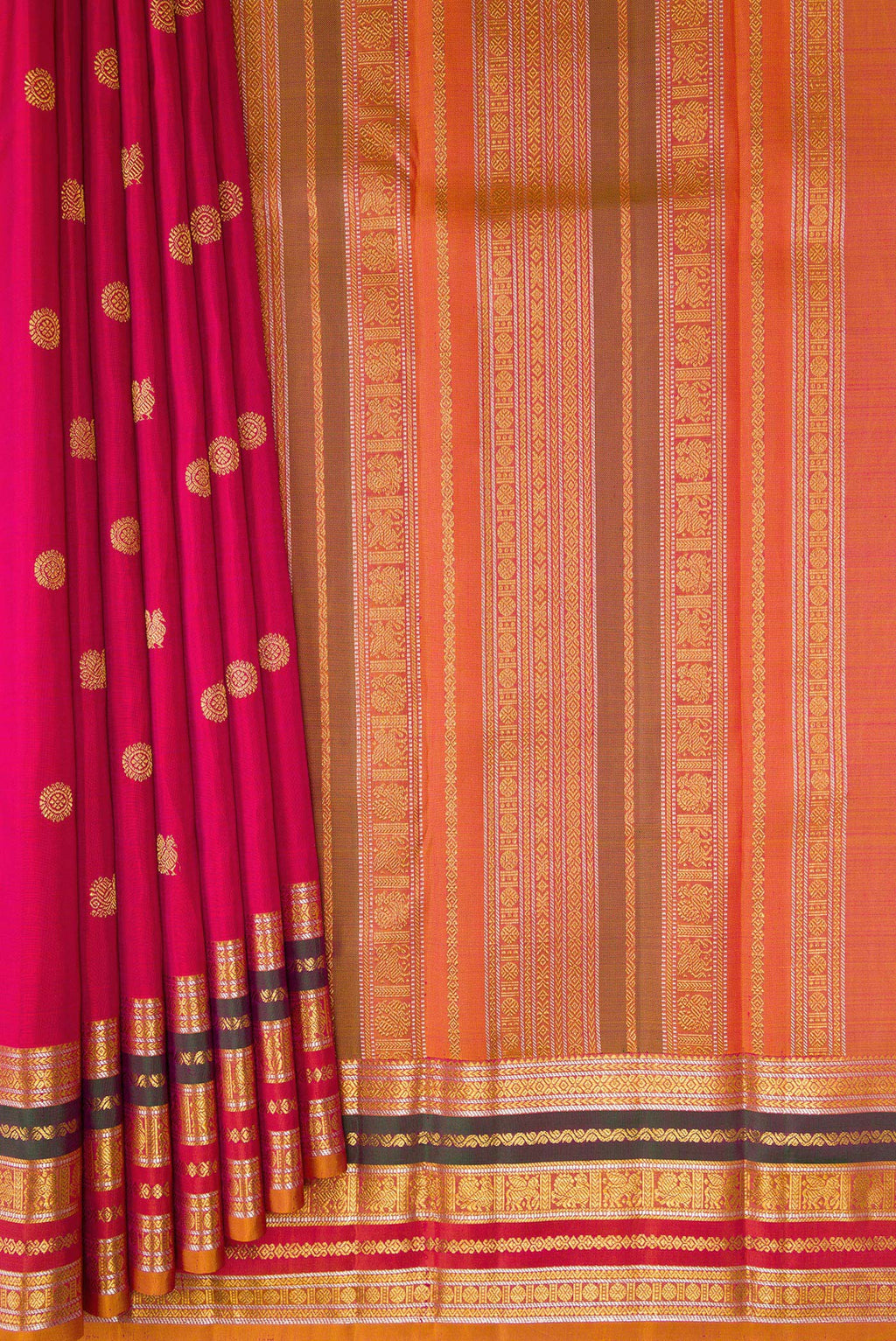 Pleats and pallu of Dark Pink Kanjivaram Silk Saree with Zari Butta on the body and Zari Border. 