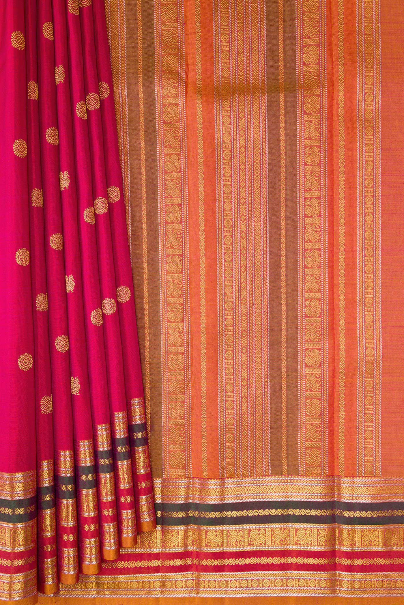 Pleats and pallu of Dark Pink Kanjivaram Silk Saree with Zari Butta on the body and Zari Border. 