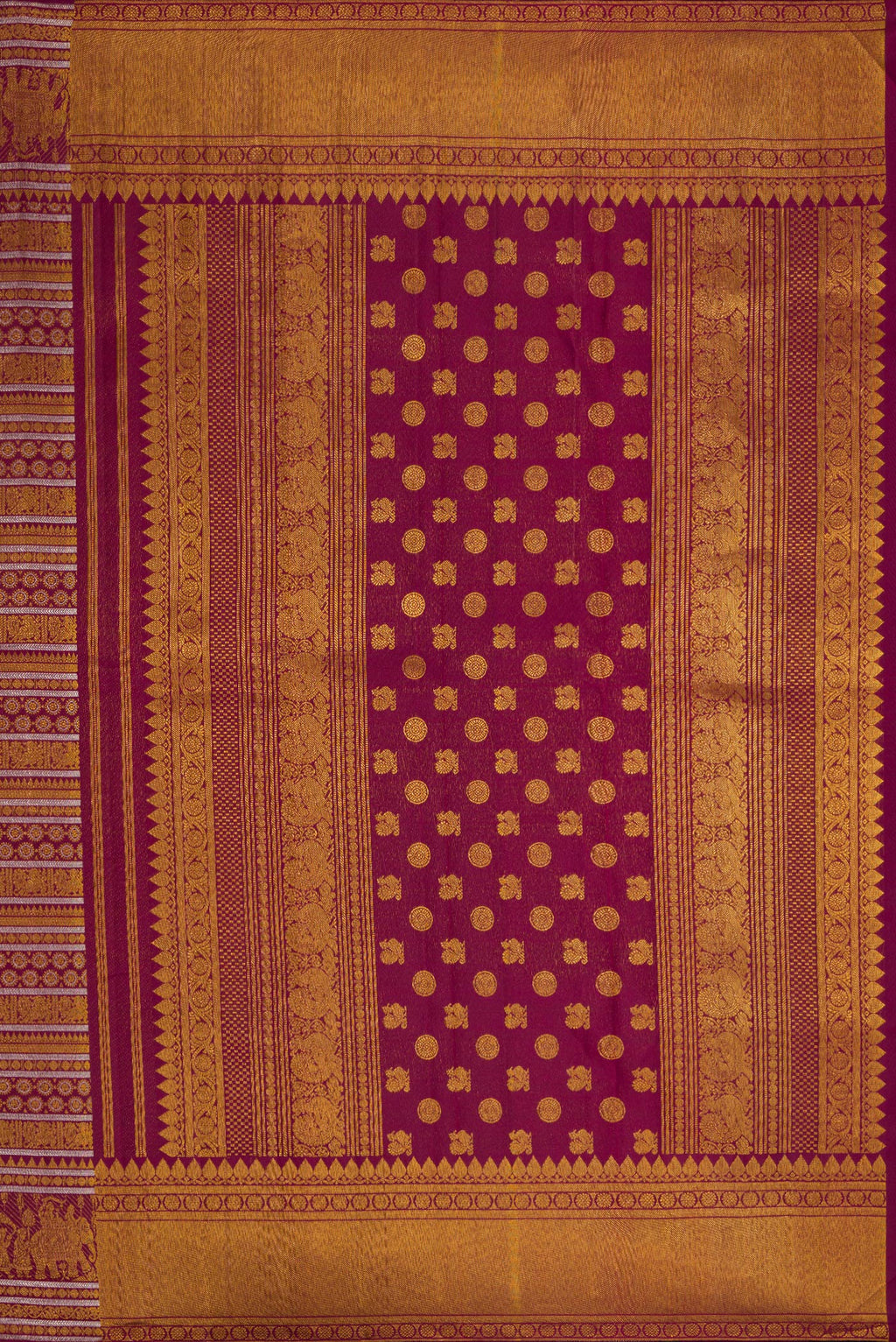 Close up image of the pallu of Burgundy Dual Tone Kanchipuram Silk Saree with Zari Brocade on the body and Zari Border. 