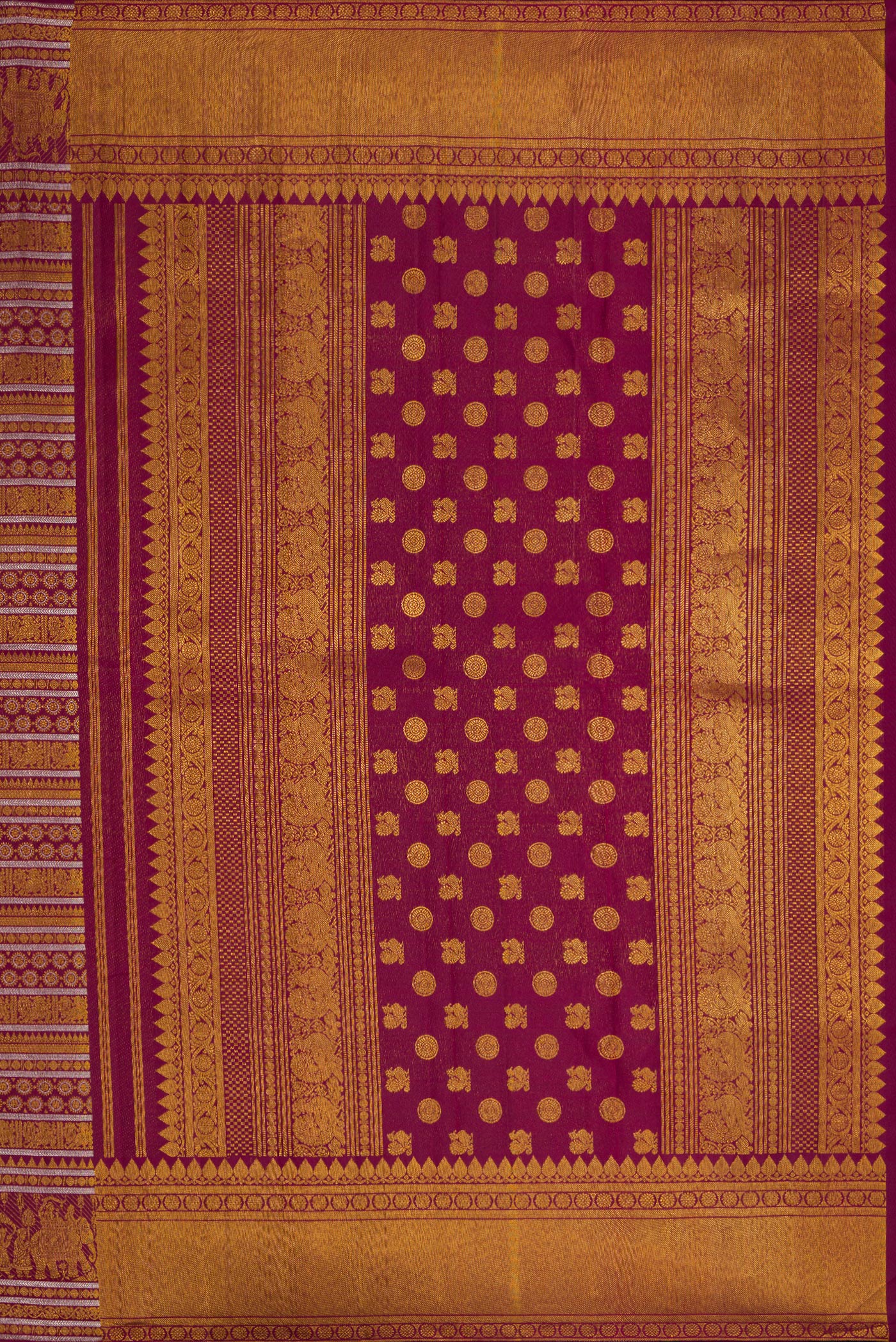 Close up image of the pallu of Burgundy Dual Tone Kanchipuram Silk Saree with Zari Brocade on the body and Zari Border. 