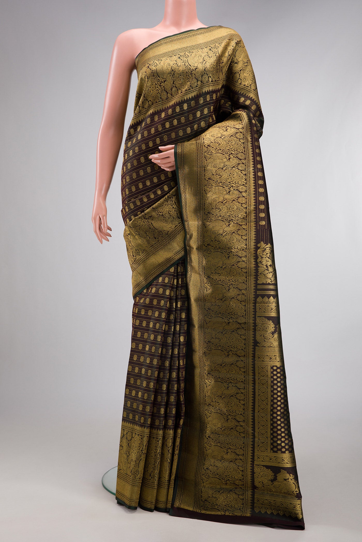 Coffee Brown Kanchipuram Silk Saree with Zari Brocade on the body and Fancy Border.  displayed on a mannequin