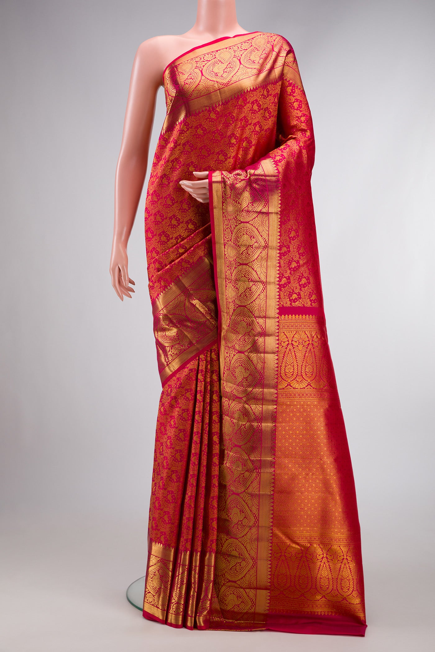 Pink Dual Tone Kanchipuram Silk Saree with Zari Brocade on the body and Zari Border.  displayed on a mannequin
