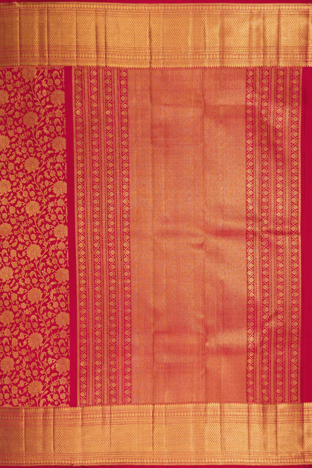 Close up image of the pallu of Maroon Dual Tone Kanchipuram Silk Saree with Zari Brocade on the body and Zari Border. 