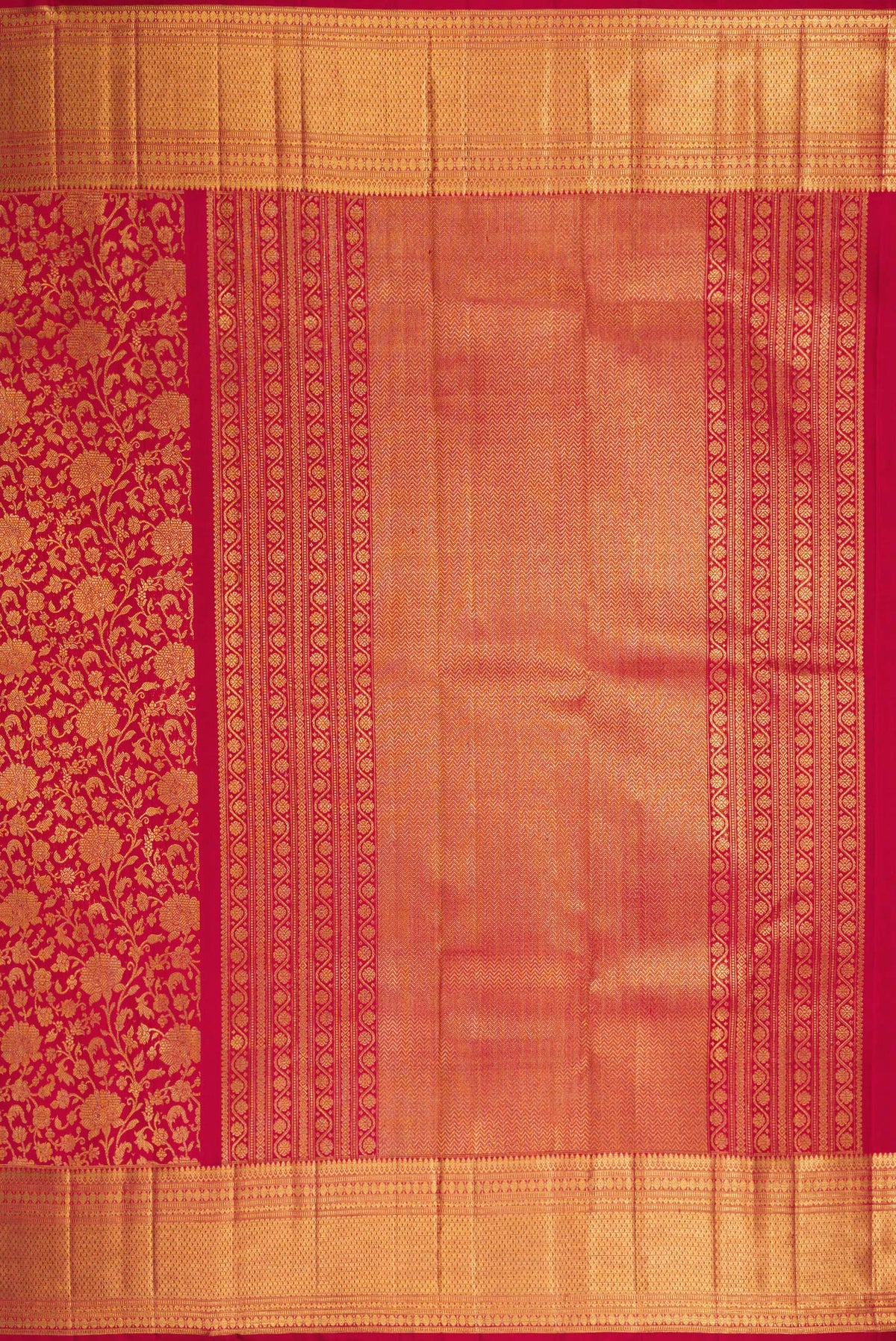 Close up image of the pallu of Maroon Dual Tone Kanchipuram Silk Saree with Zari Brocade on the body and Zari Border. 