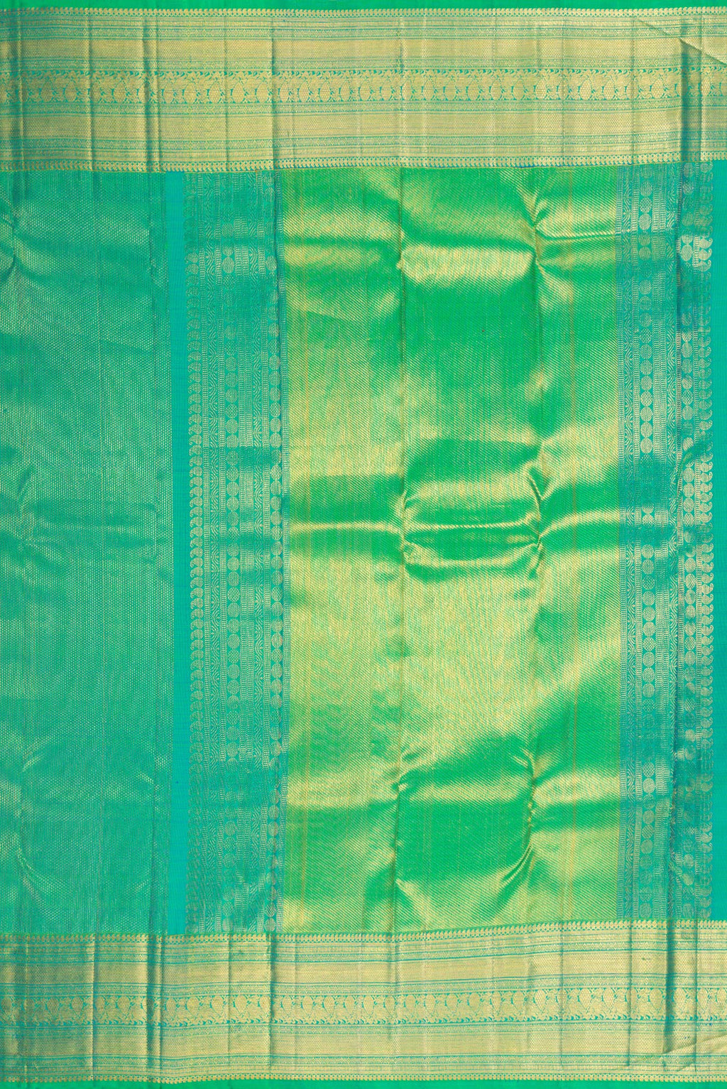 Close up image of the pallu of Green Dual Tone Kanchipuram Silk Saree with Zari Brocade on the body and Fancy Border. 