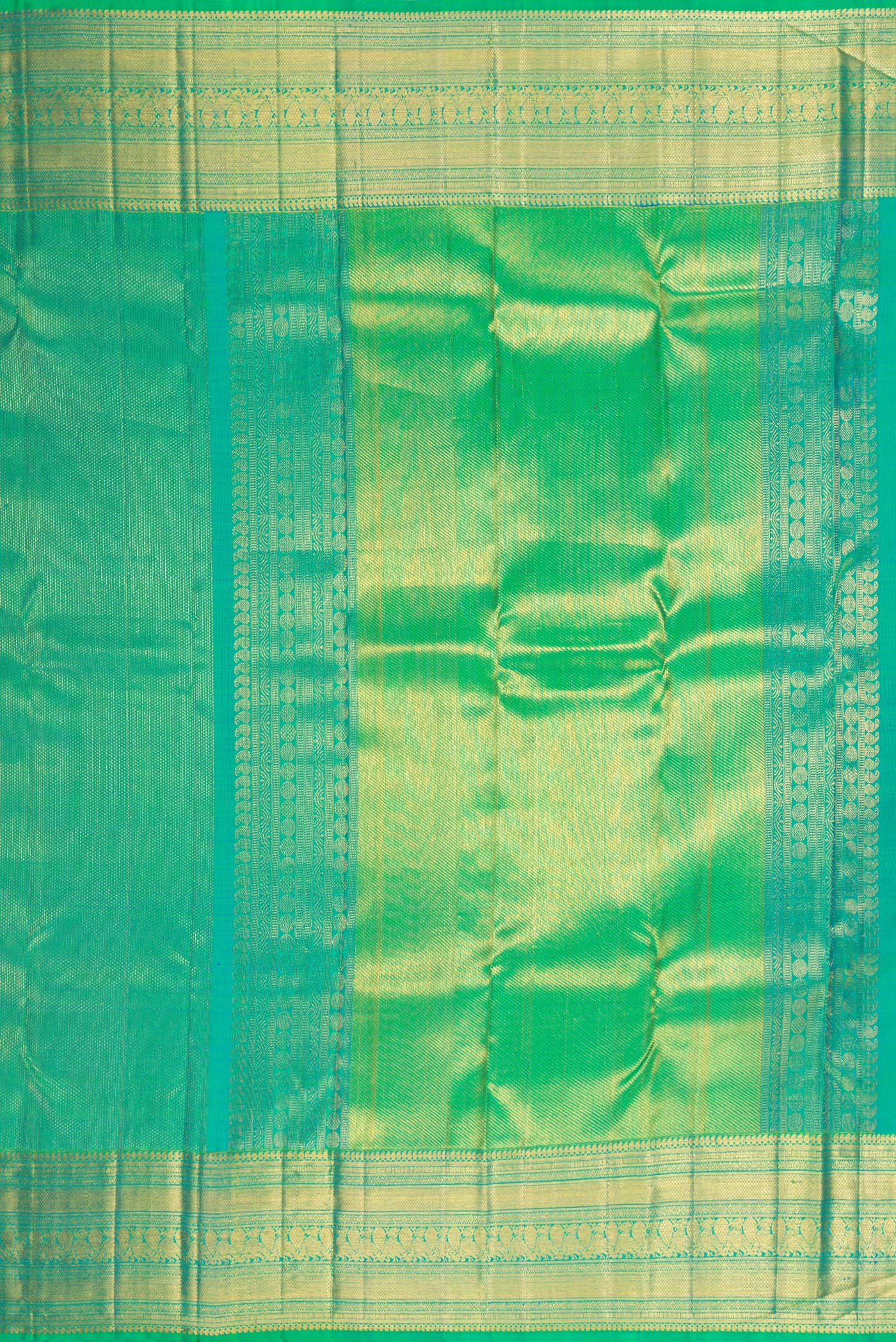 Close up image of the pallu of Green Dual Tone Kanchipuram Silk Saree with Zari Brocade on the body and Fancy Border. 