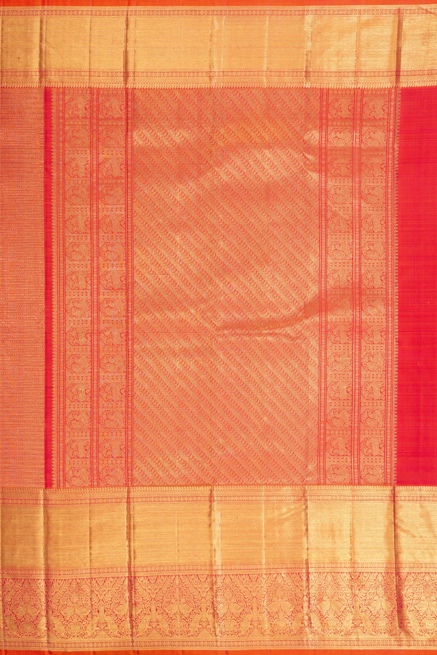 Close up image of the pallu of Coral Dual Tone Kanchipuram Silk Saree with Zari Brocade on the body and Zari Border. 