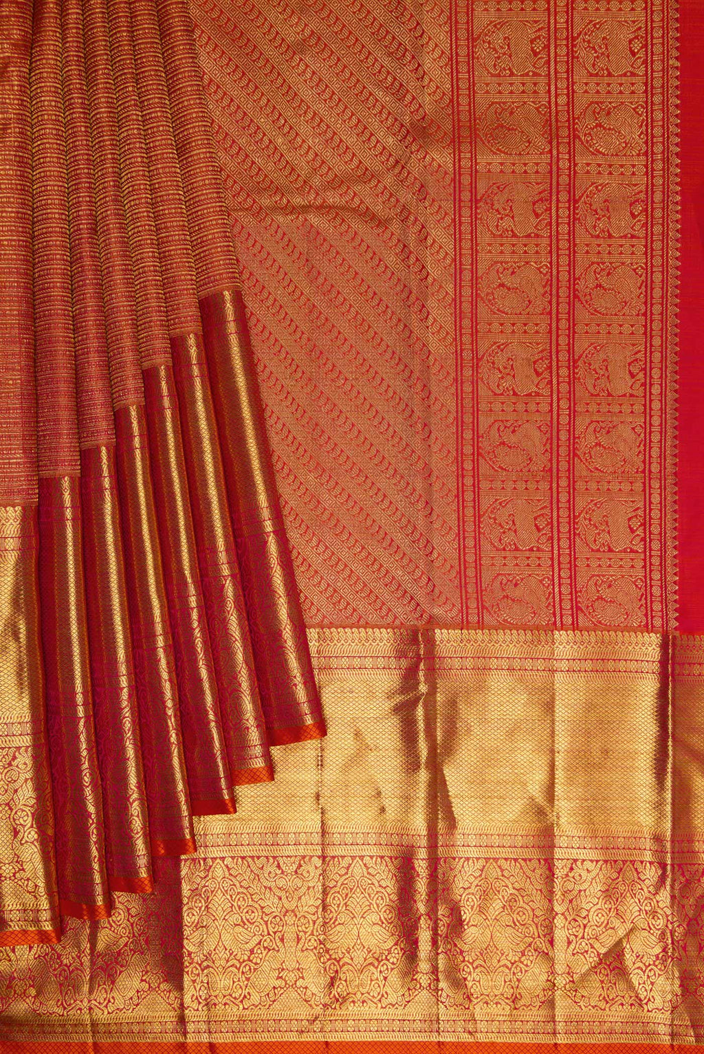 Pleats and pallu of Coral Dual Tone Kanchipuram Silk Saree with Zari Brocade on the body and Zari Border. 