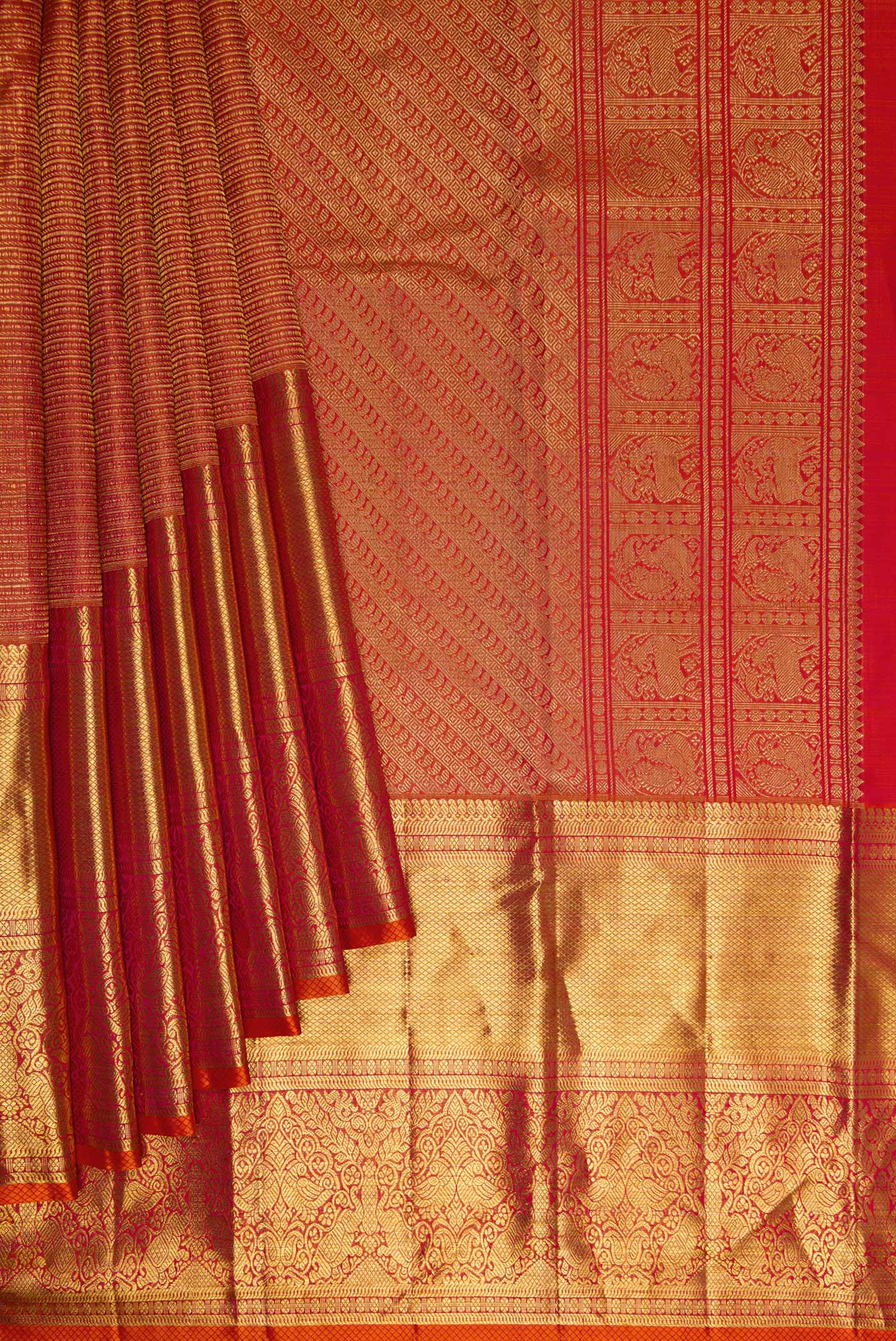 Pleats and pallu of Coral Dual Tone Kanchipuram Silk Saree with Zari Brocade on the body and Zari Border. 