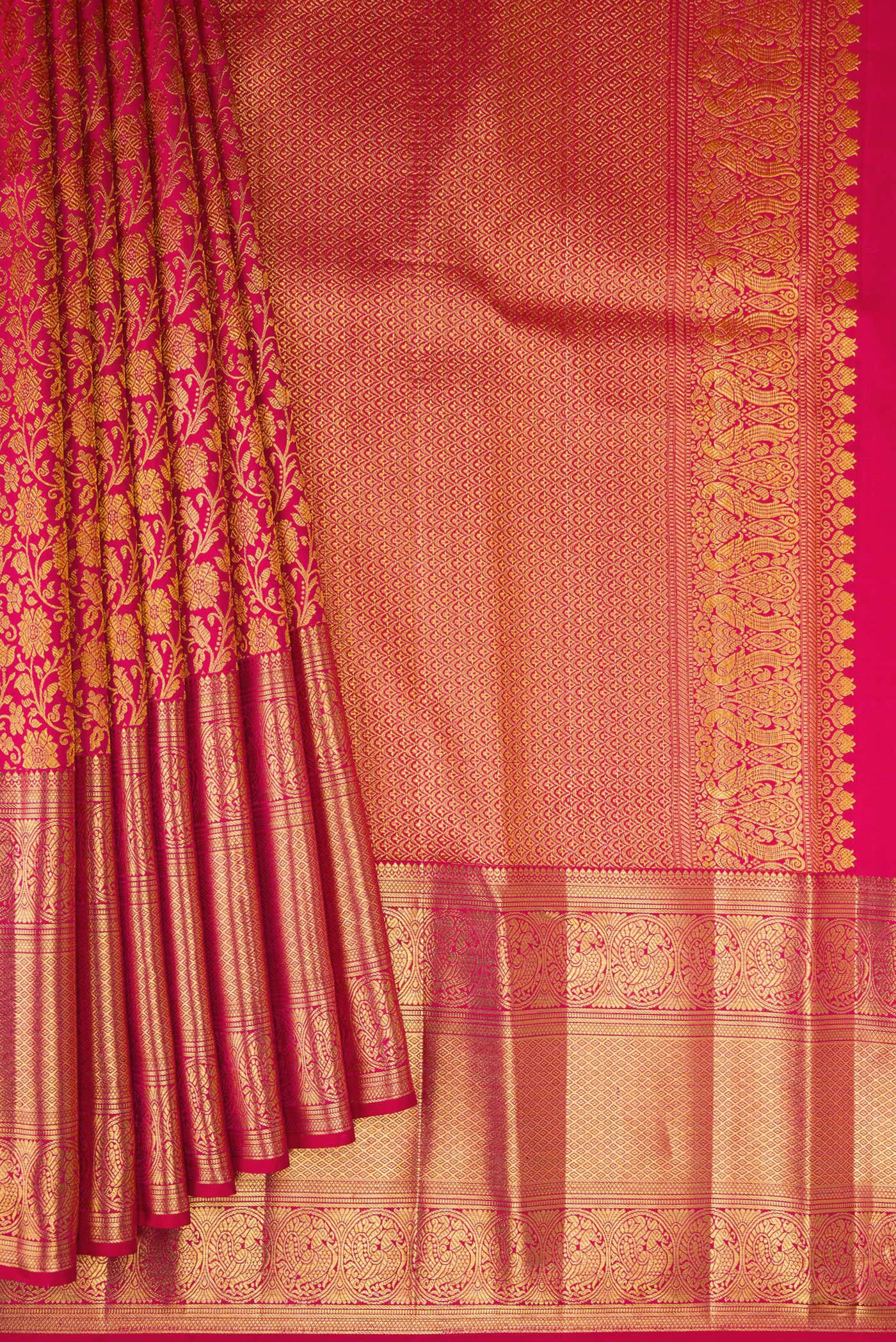 Pleats and pallu of Dark Pink Kanchipuram Silk Saree with Zari Brocade on the body and Zari Border. 