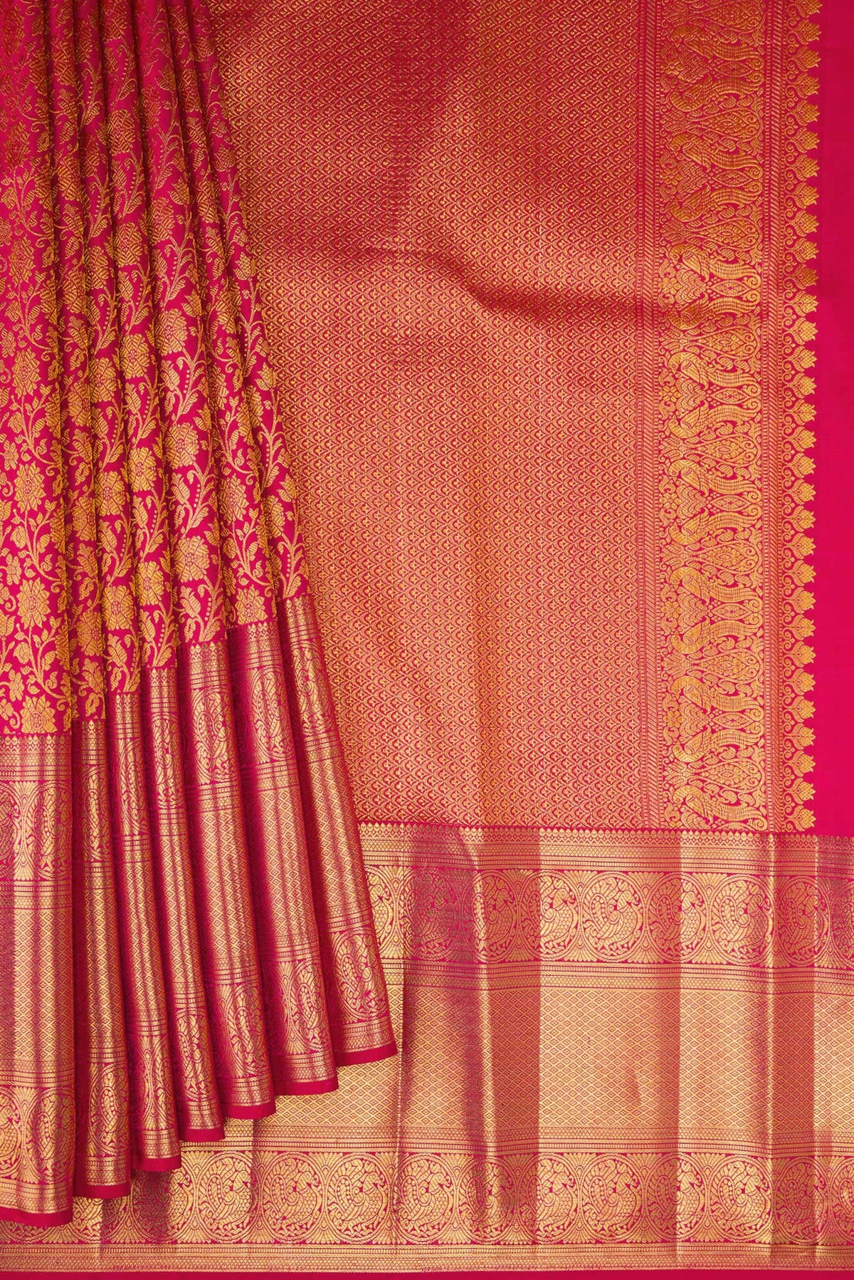 Pleats and pallu of Dark Pink Kanchipuram Silk Saree with Zari Brocade on the body and Zari Border. 