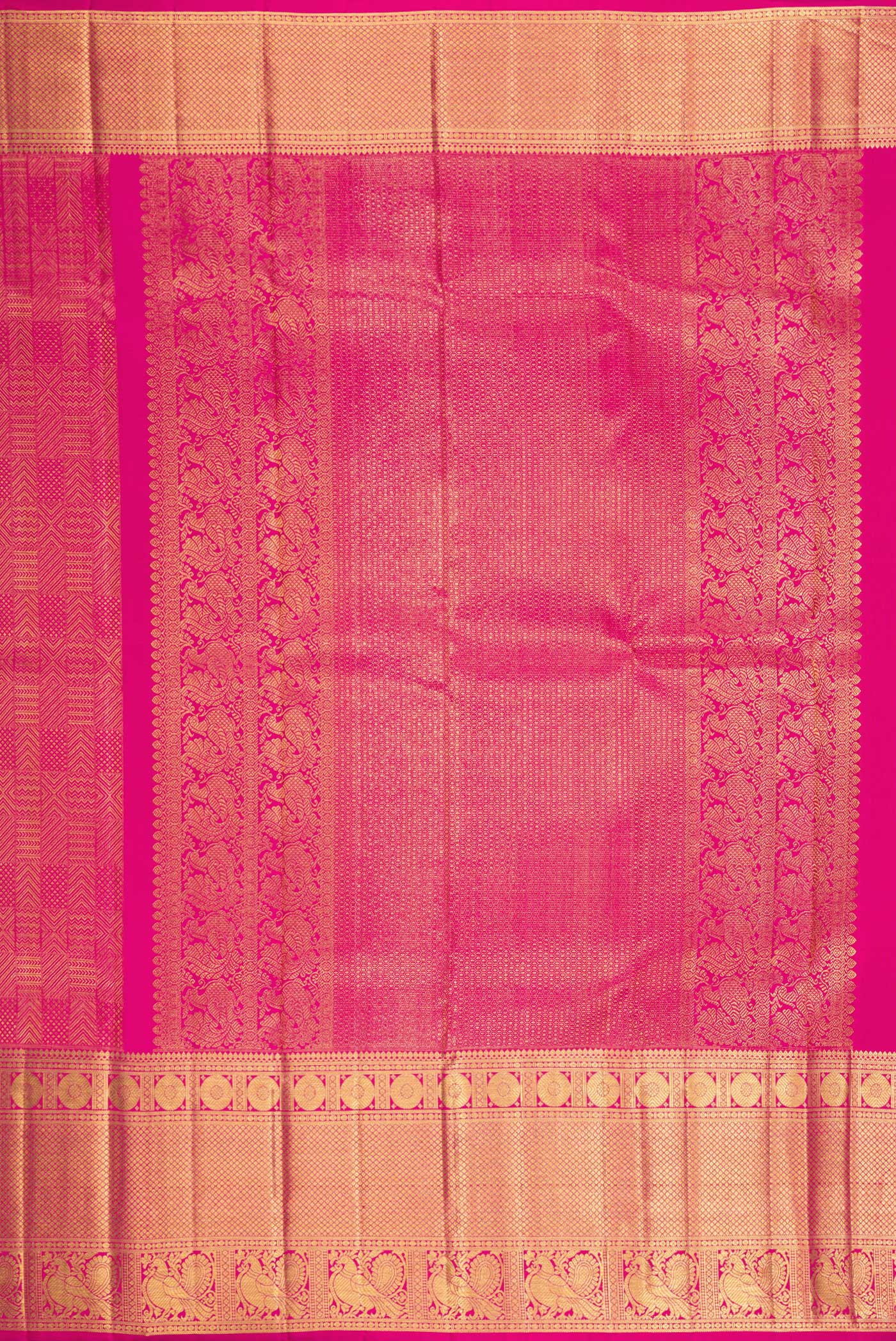 Close up image of the pallu of Dark Pink Kanchipuram Silk Saree with Zari Brocade on the body and Zari Border. 