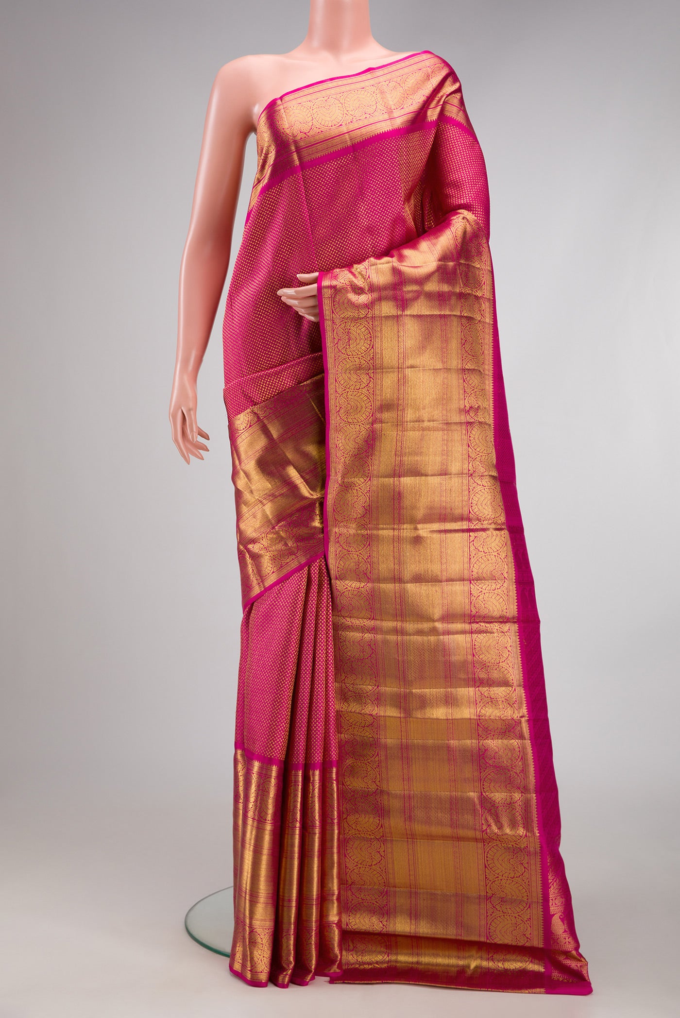 Pink Kanchipuram Silk Saree with Zari Brocade on the body and Fancy Border.  displayed on a mannequin