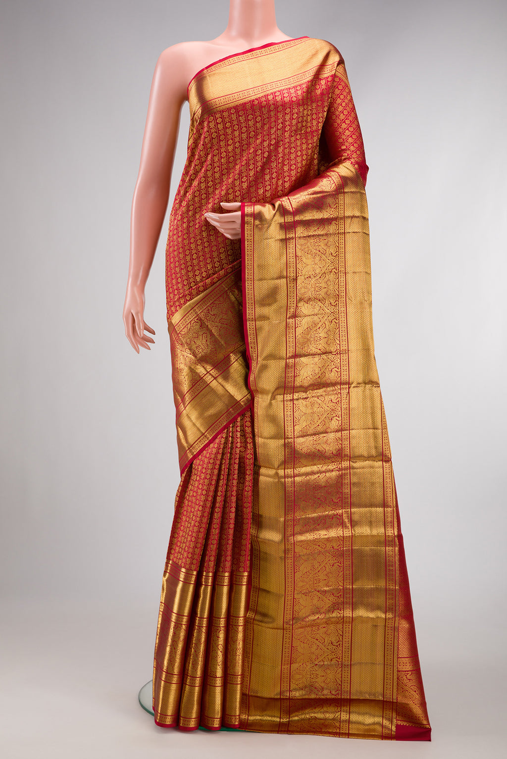 Maroon Dual Tone Kanchipuram Silk Saree with Zari Brocade on the body and Zari Border.  displayed on a mannequin