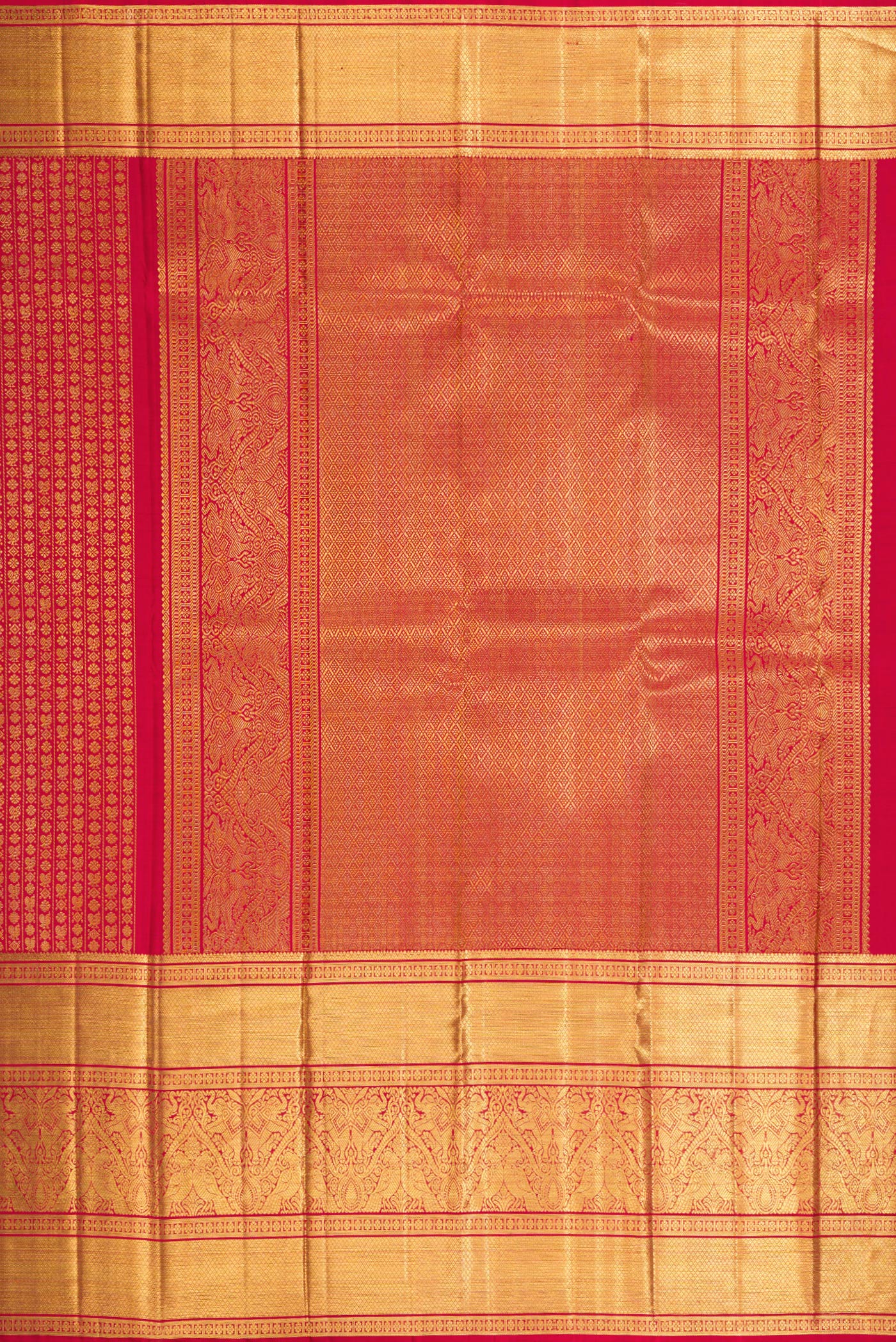 Close up image of the pallu of Maroon Dual Tone Kanchipuram Silk Saree with Zari Brocade on the body and Zari Border. 