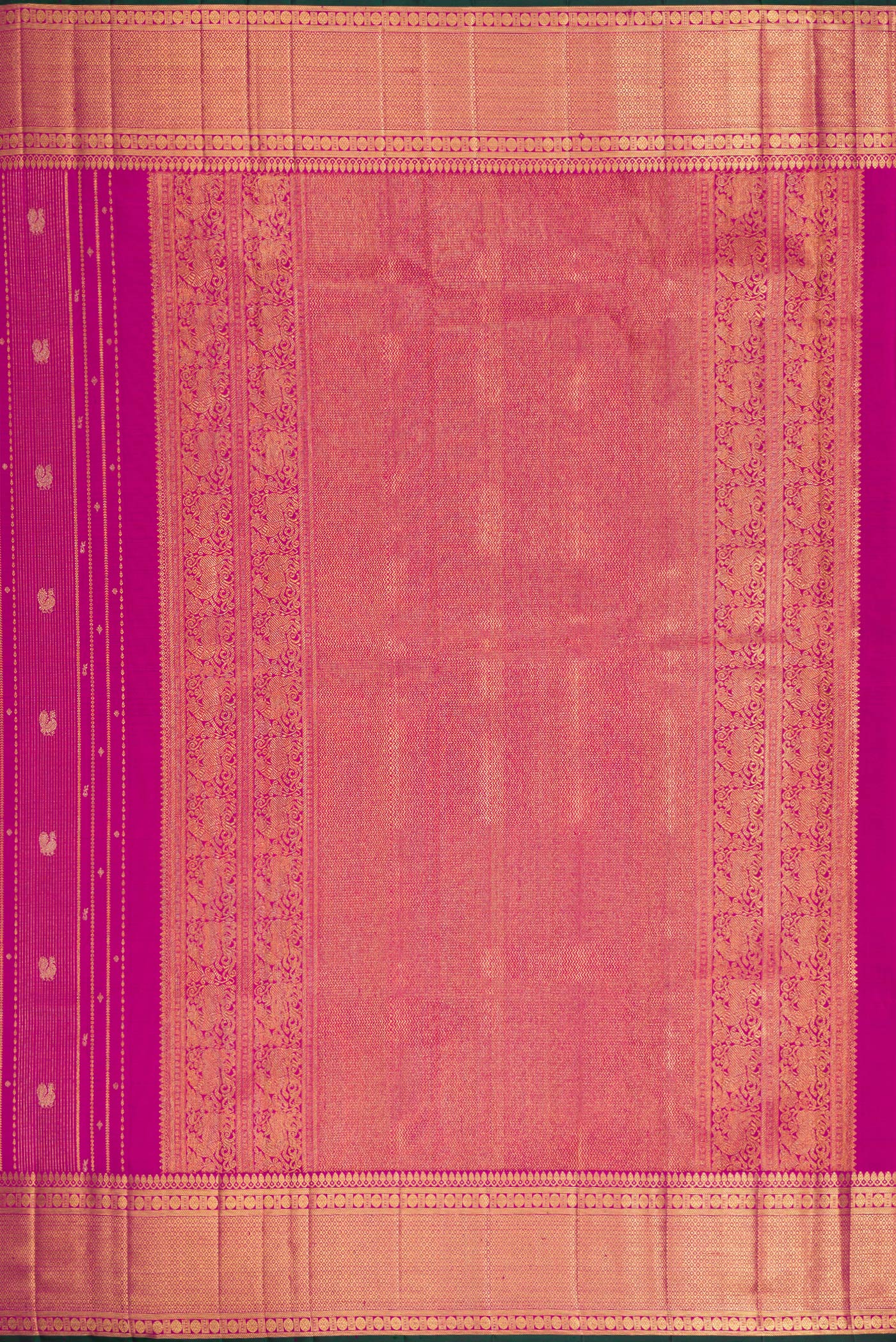 Close up image of the pallu of Magenta Dual Tone Kanchipuram Silk Saree with Zari Brocade on the body and Zari Border. 